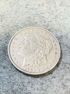 1921 US Morgan Silver Dollar struck at the Philadelphia Mint. This coin is composed of 90 