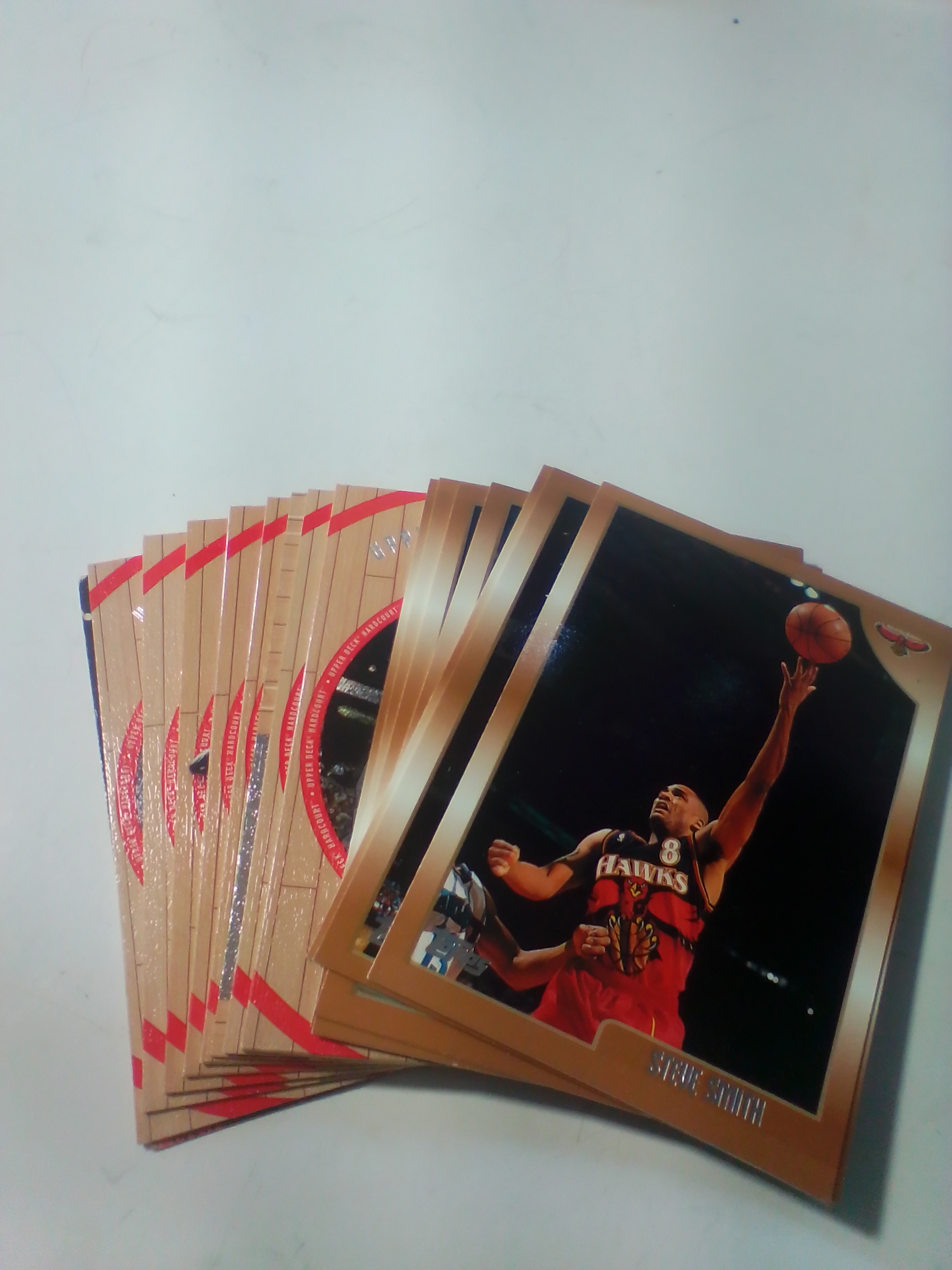 A Collection of Late 1990s NBA Basketball Trading Cards Including Upper Deck Hardcourt and SkyBox Z-Force