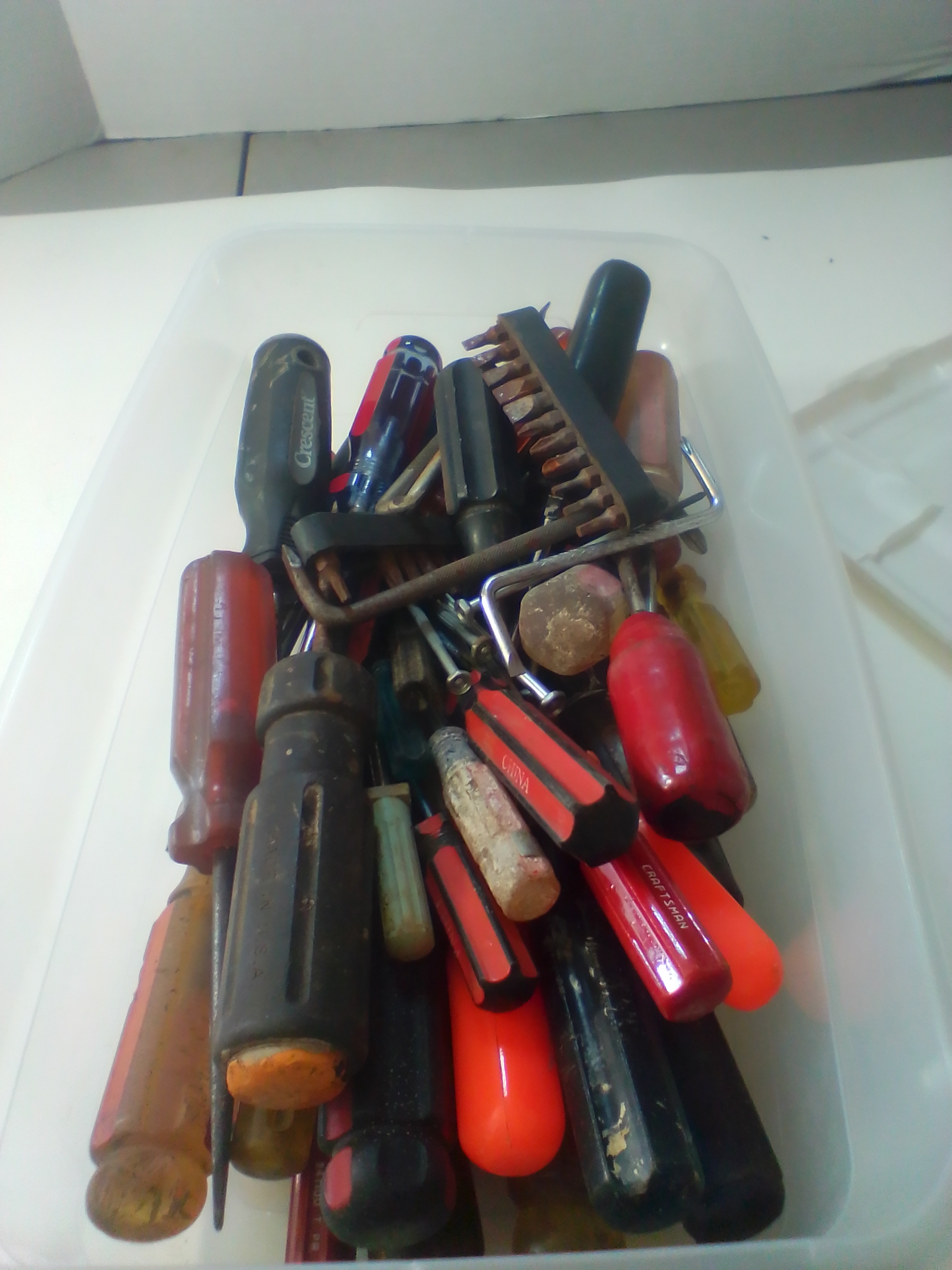 An Assortment of Multi-Brand Hand Tools and Driver Bits in Storage Bin