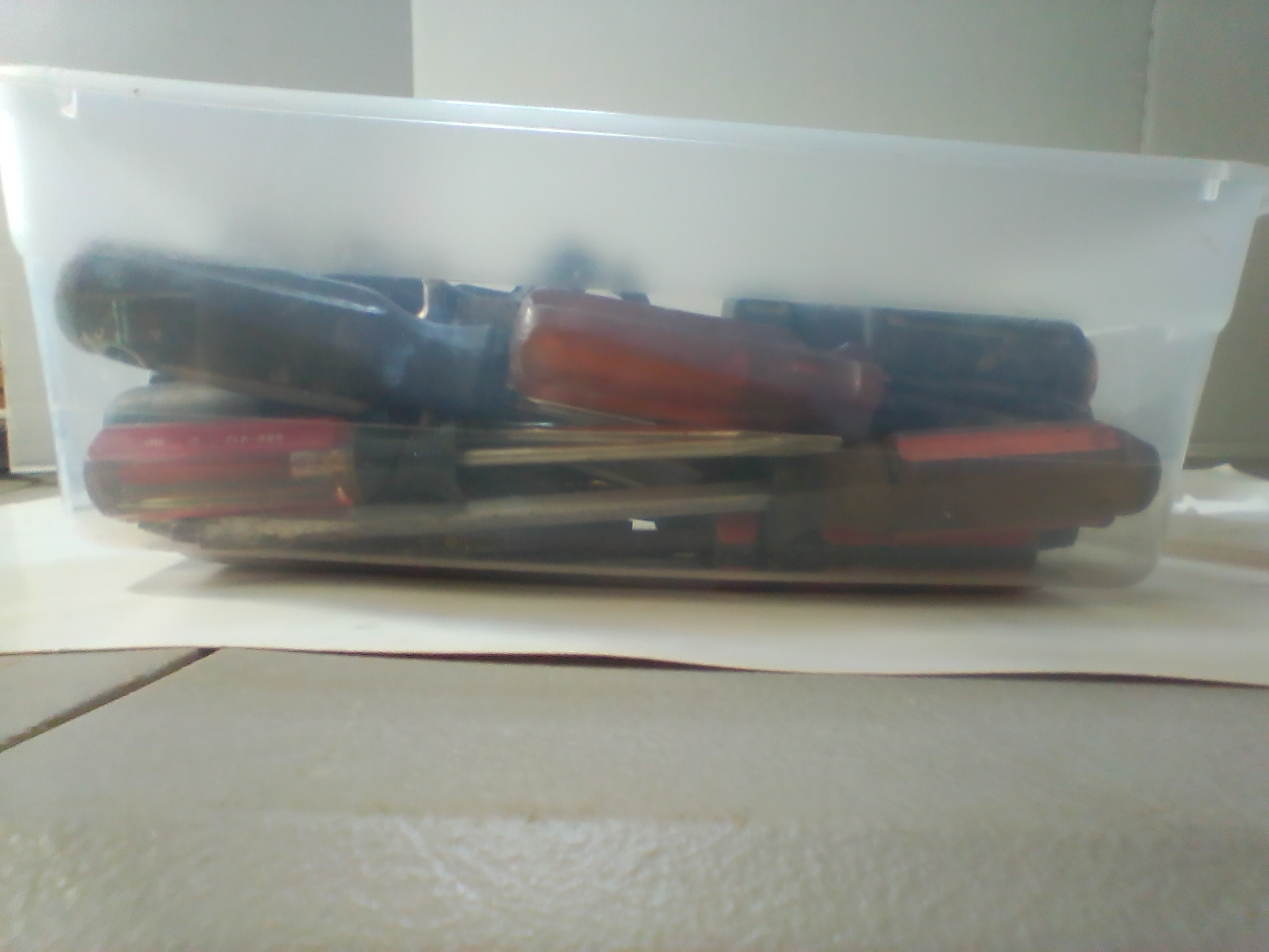 An Assortment of Multi-Brand Hand Tools and Driver Bits in Storage Bin