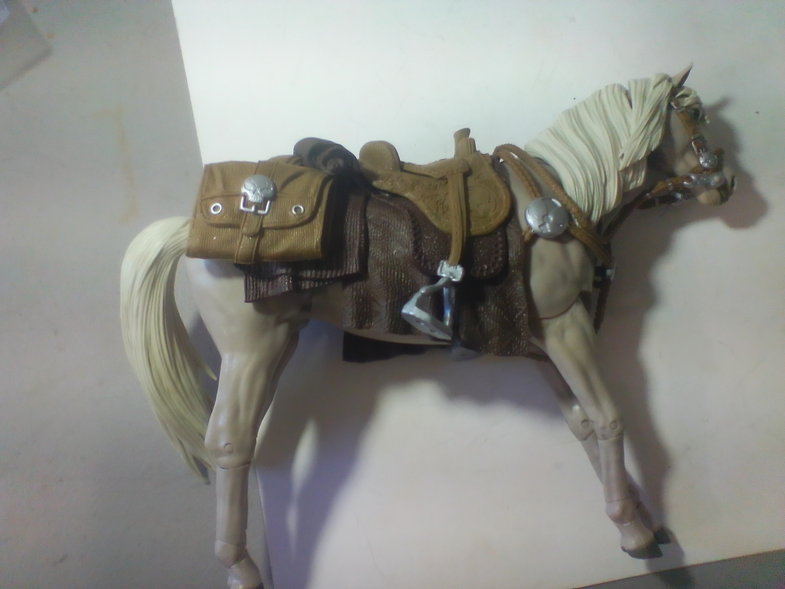 Articulated Model Horse with Western Style Tack and Skull Emblem Saddlebags