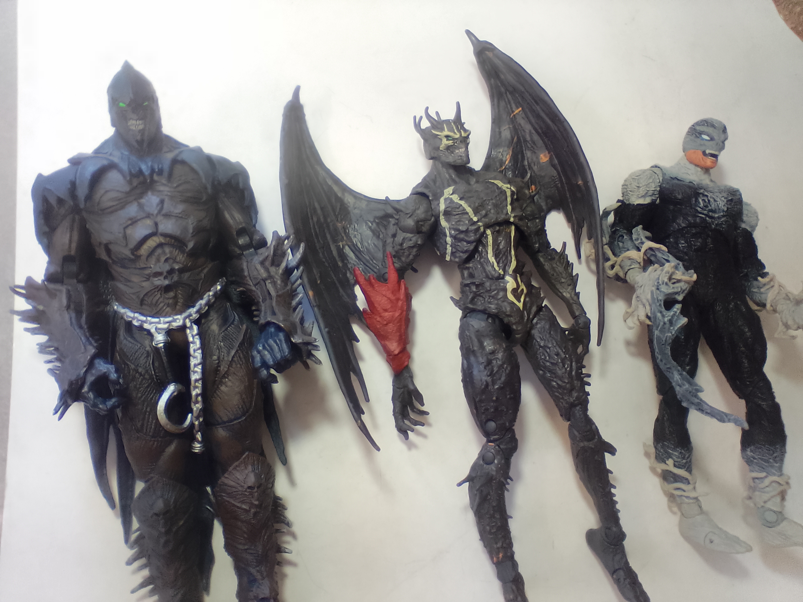 Three McFarlane Toys Spawn Universe 7 Inch Articulated Action Figures A Pair of TMP Intl. LLC Articulated Plastic Spawn Action Figures