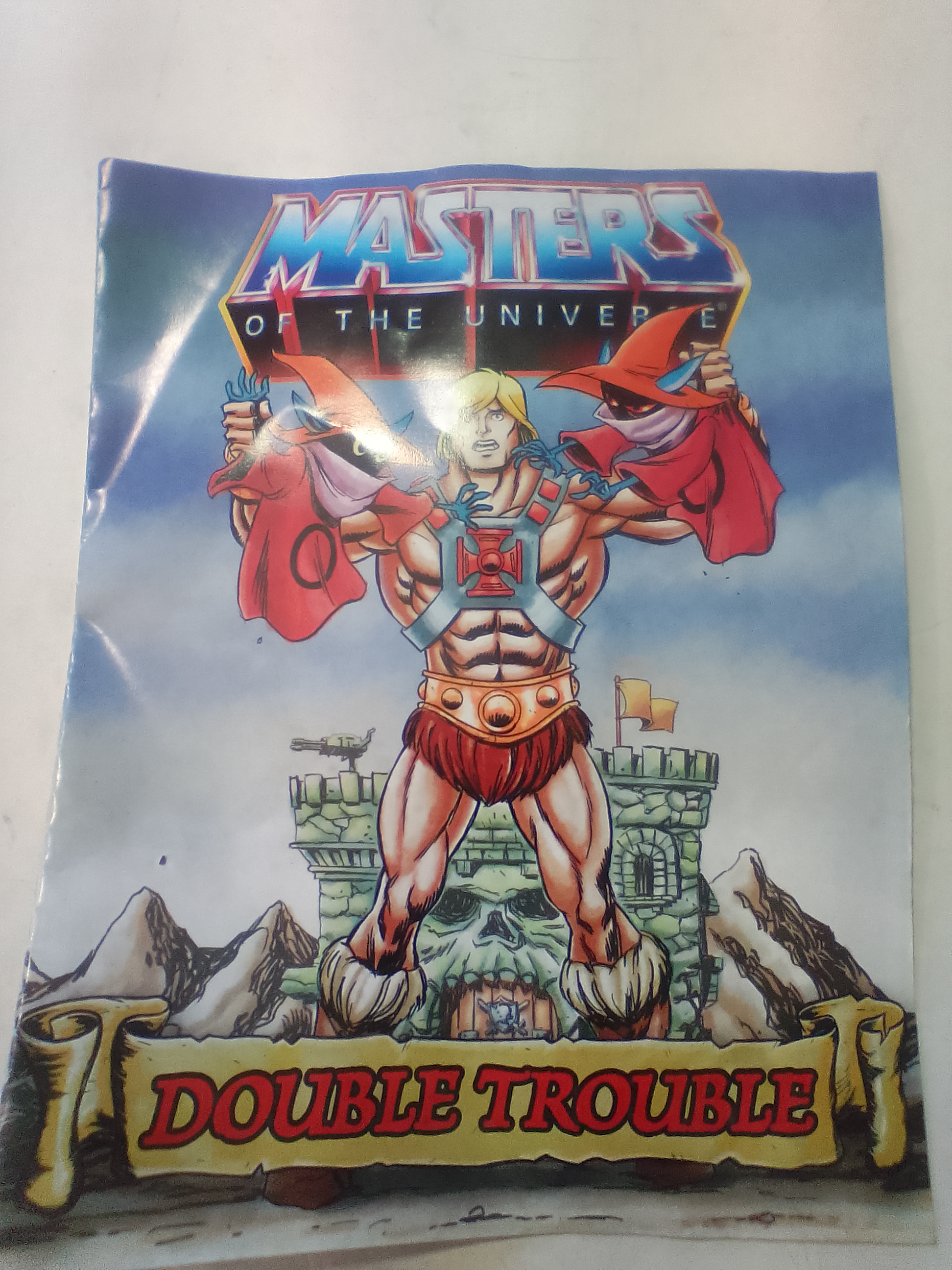 An Assortment of Masters of the Universe Action Figures and Accessories Featuring Skeletor and Scare Glow