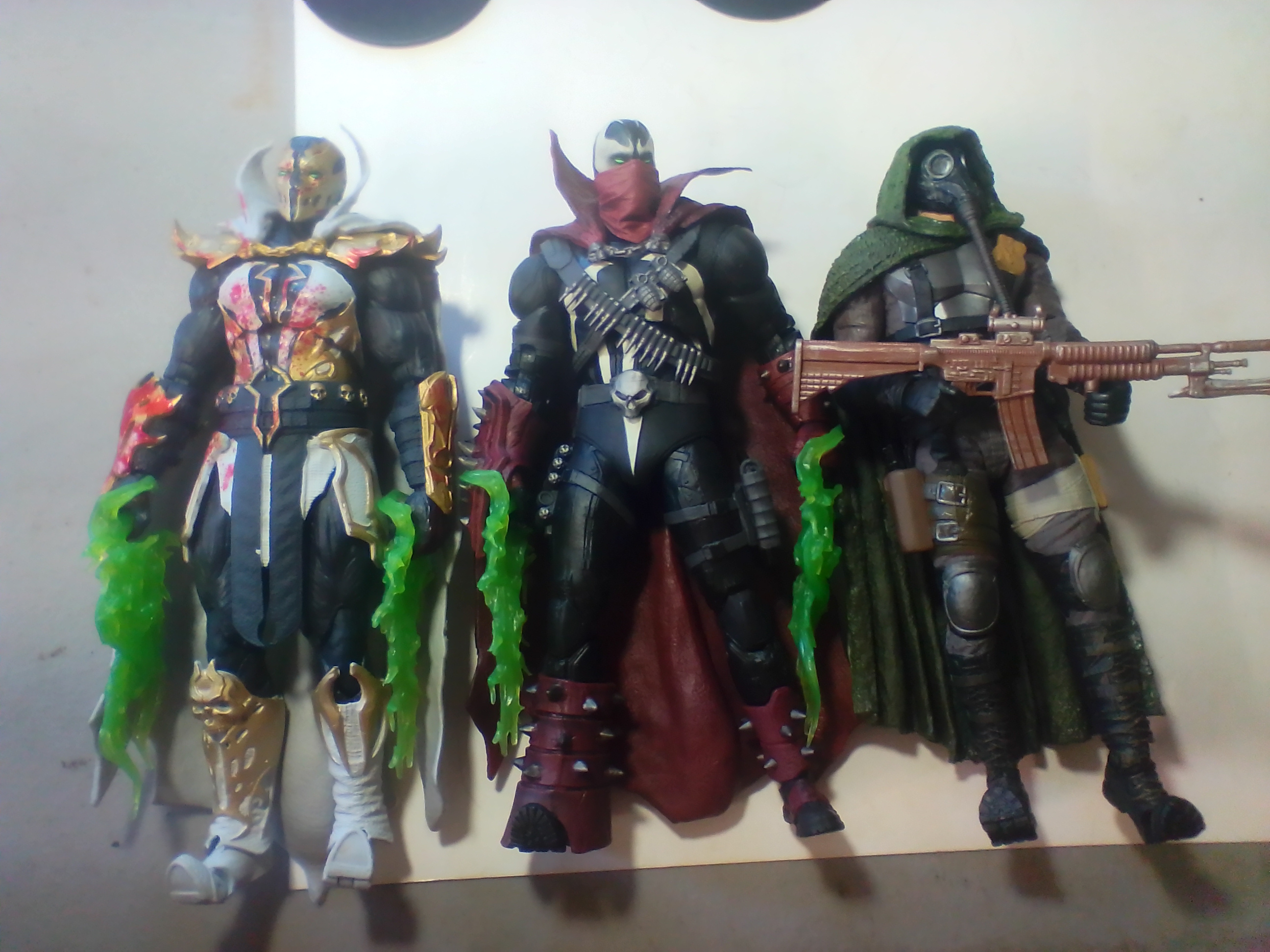 Three Articulated Plastic Action Figures Including Redeemer and Commando Spawn