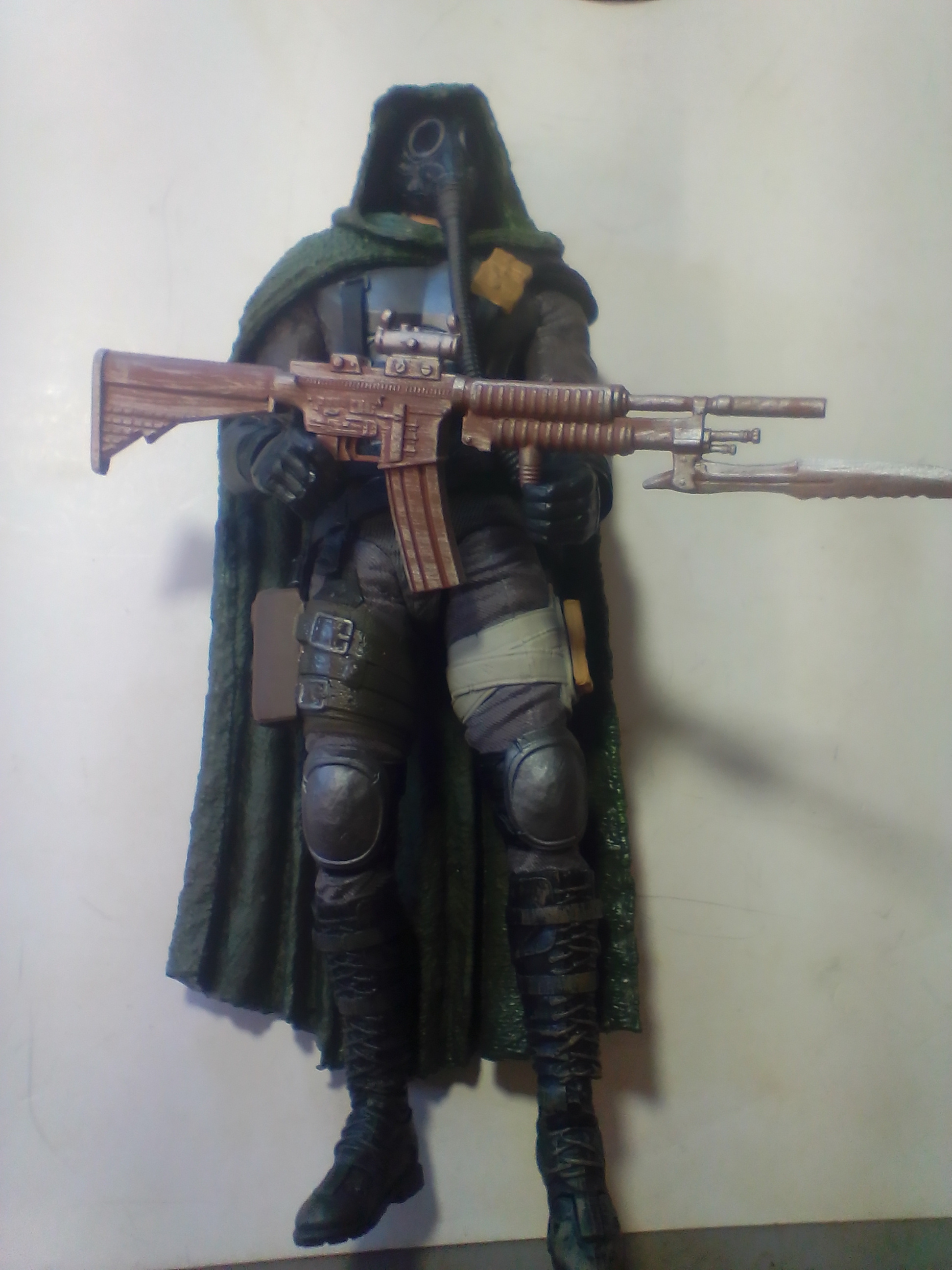 Three Articulated Plastic Action Figures Including Redeemer and Commando Spawn