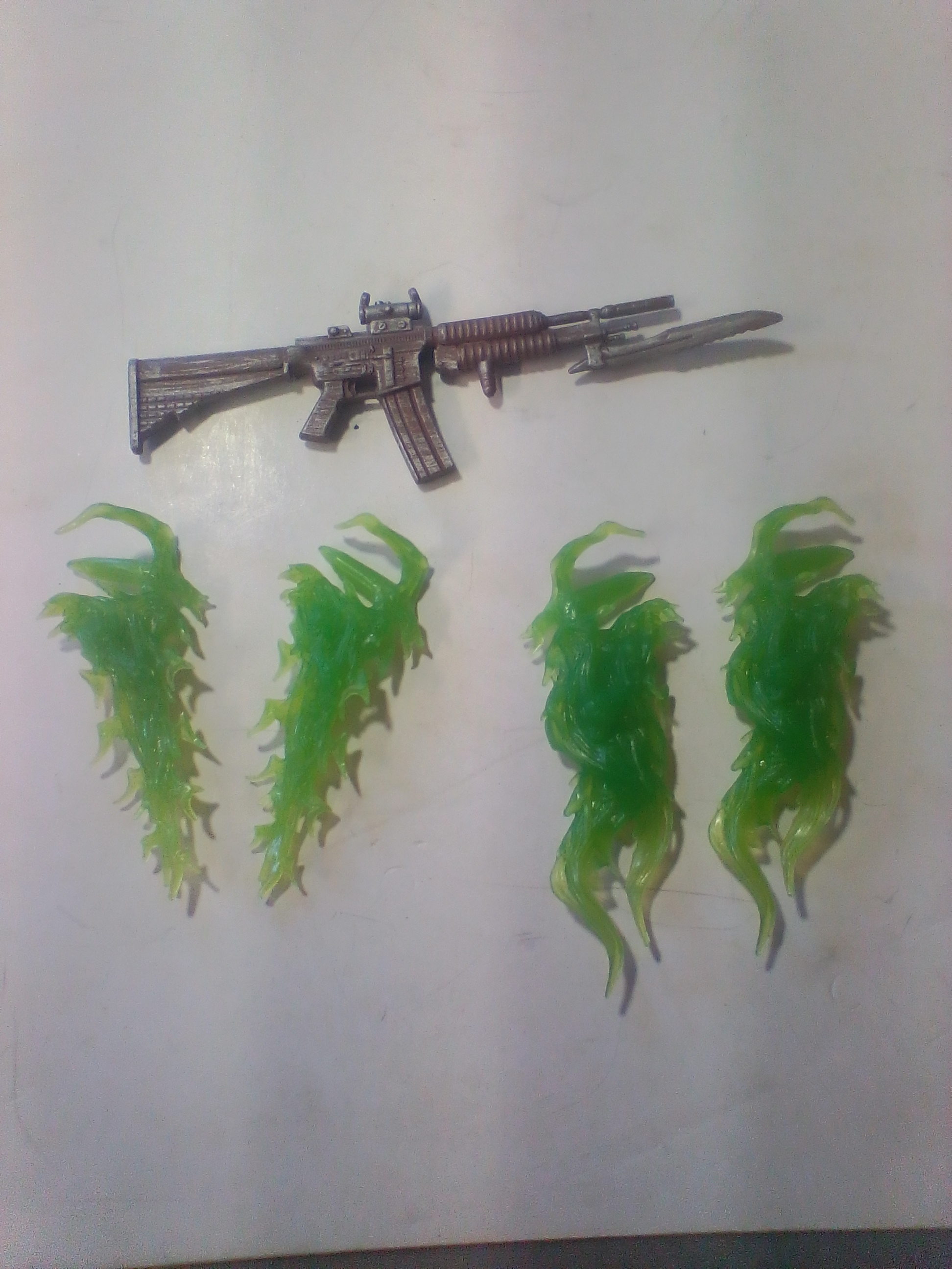 Three Articulated Plastic Action Figures Including Redeemer and Commando Spawn