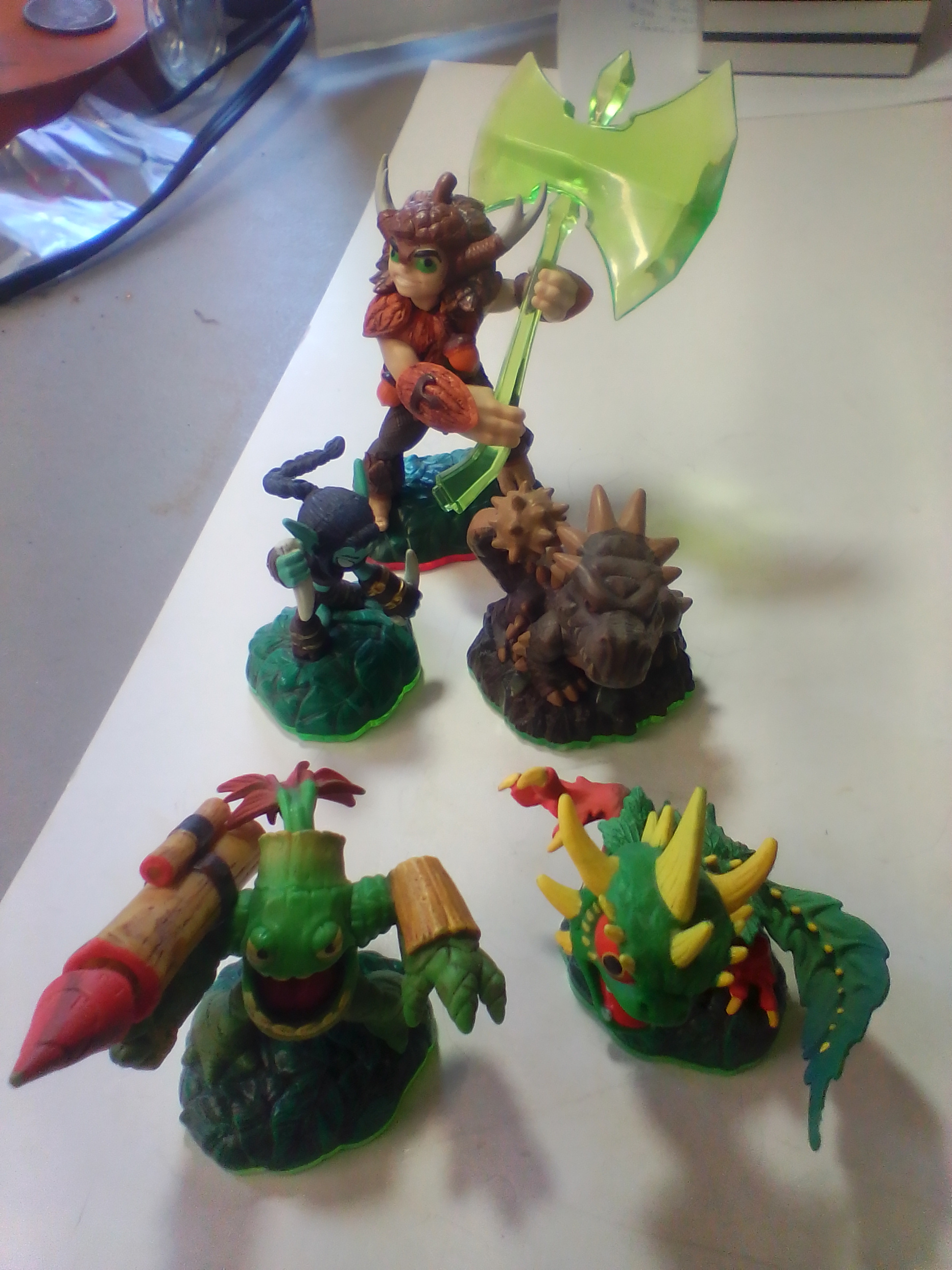 A Collection of Skylanders Interactive Game Figures Including Trap Master Bushwhack
