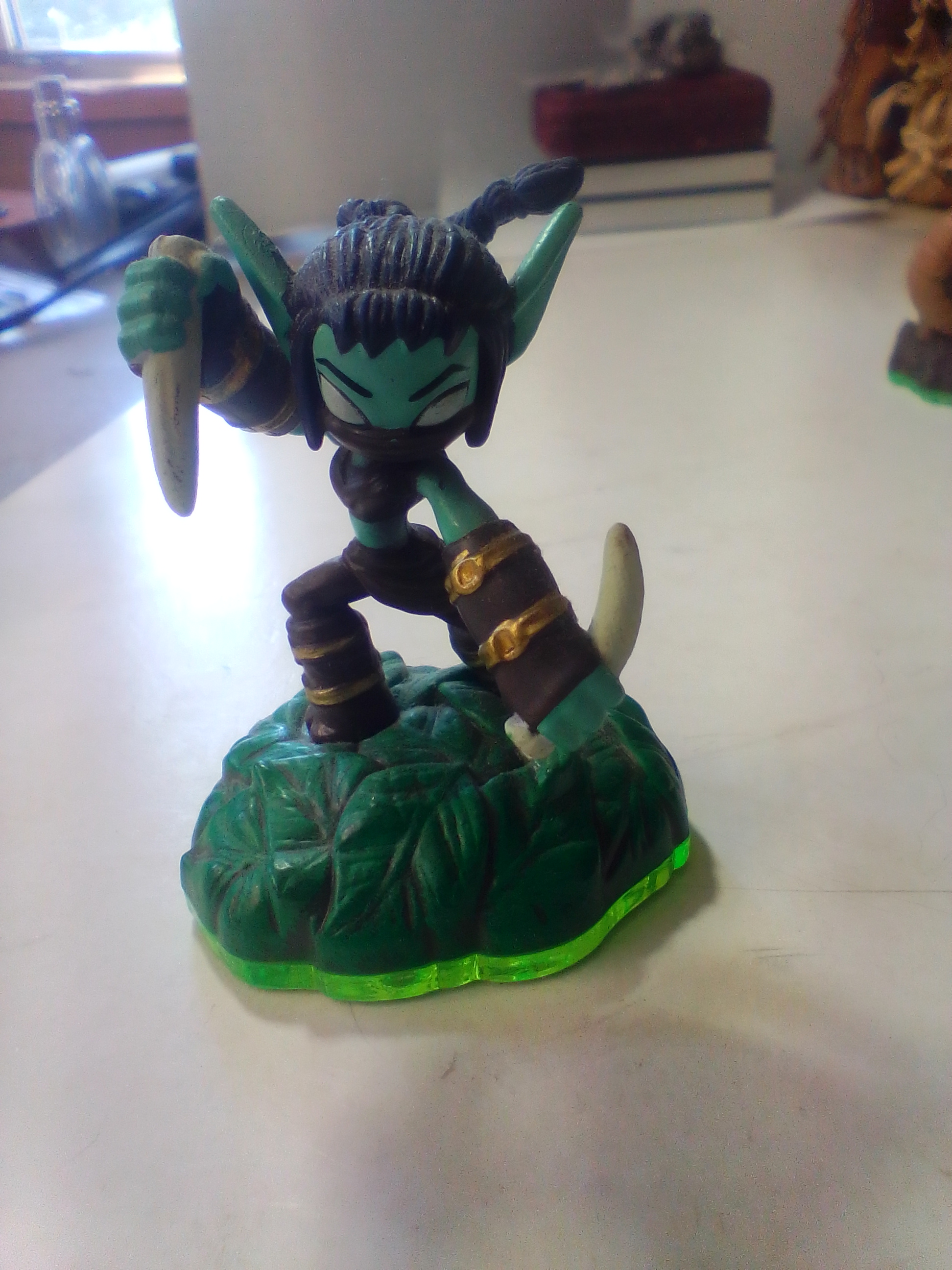 A Collection of Skylanders Interactive Game Figures Including Trap Master Bushwhack
