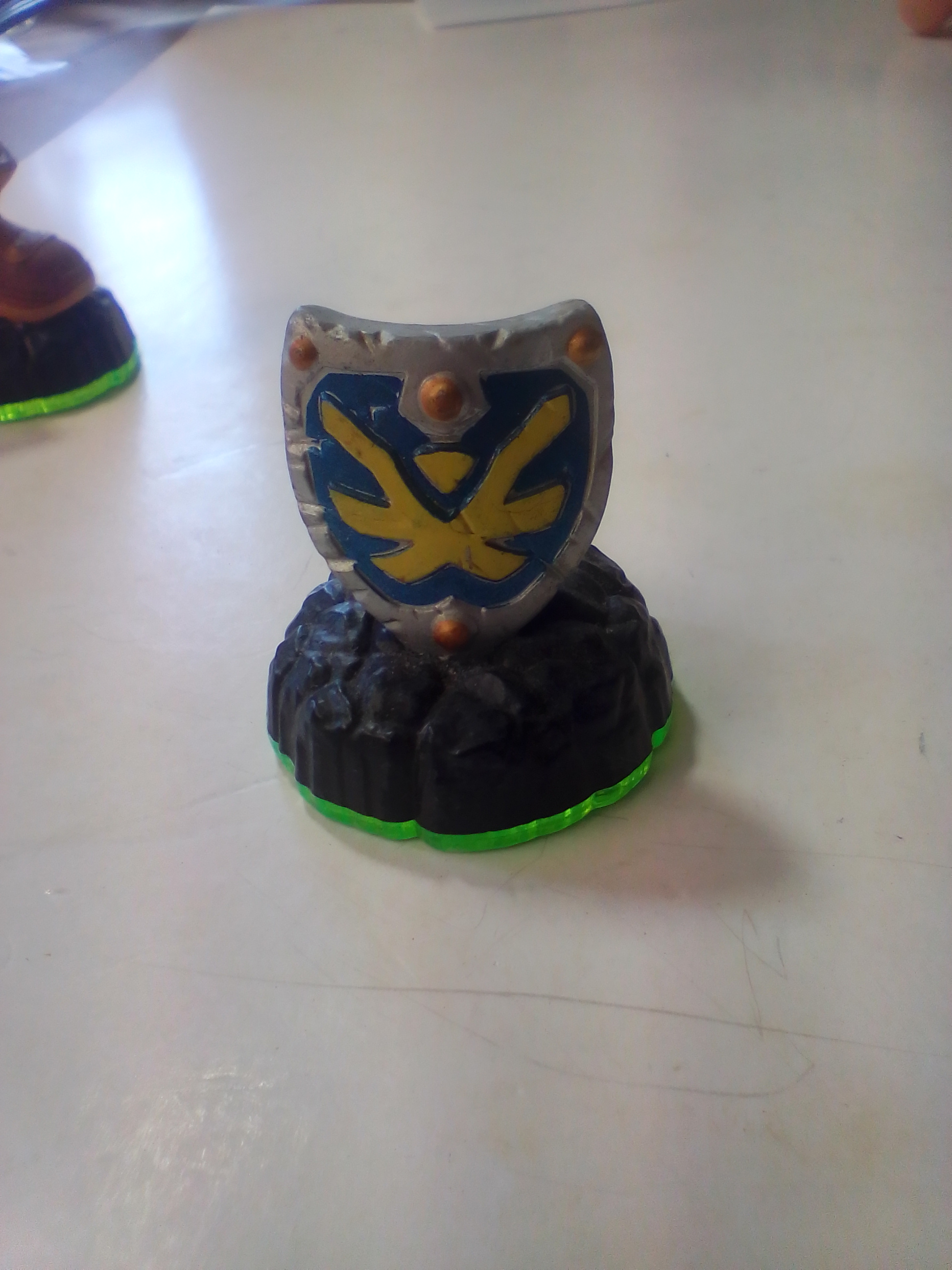 A Collection of Skylanders Interactive Game Pieces and Fire Creation Crystal