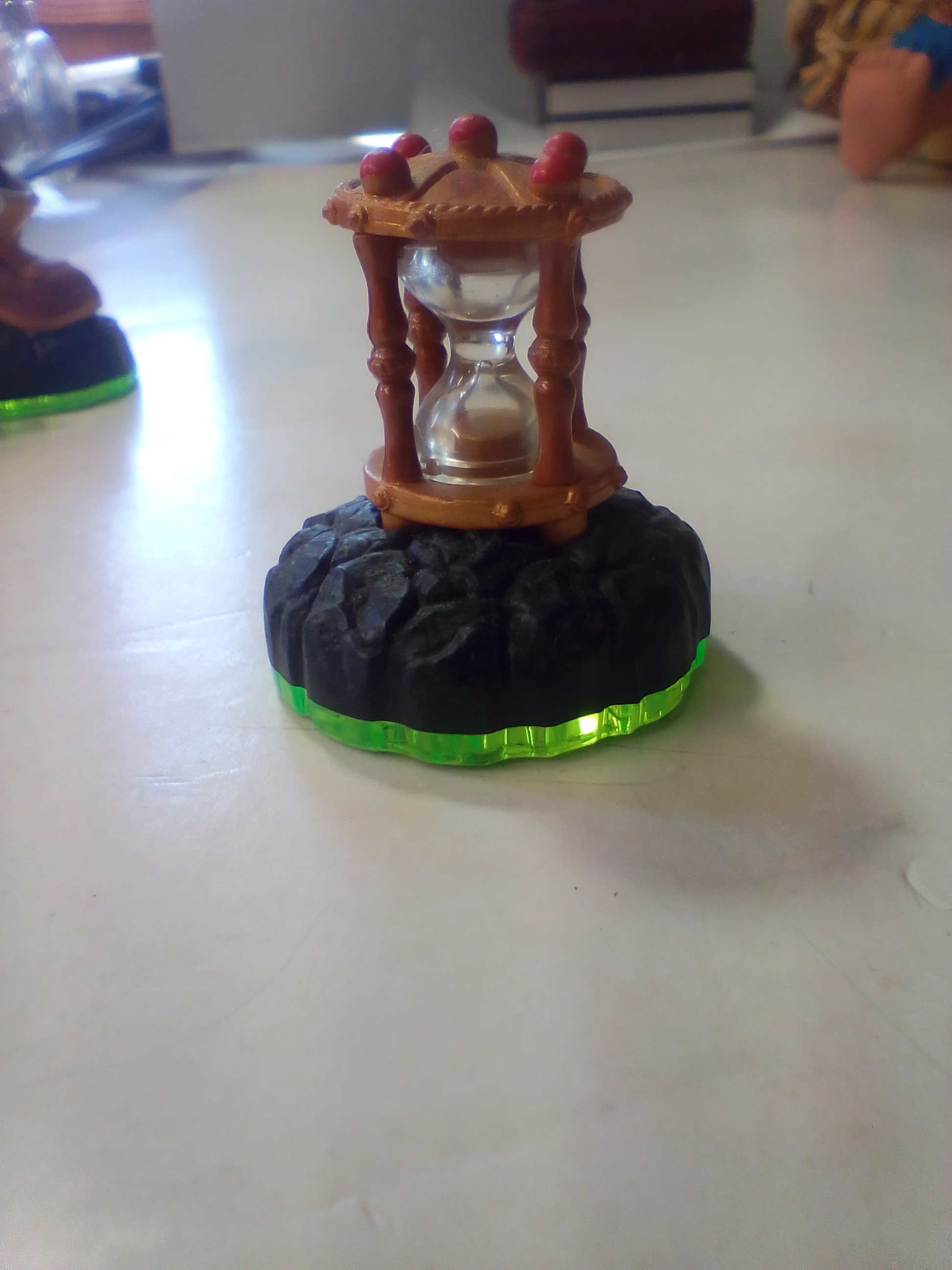 A Collection of Skylanders Interactive Game Pieces and Fire Creation Crystal