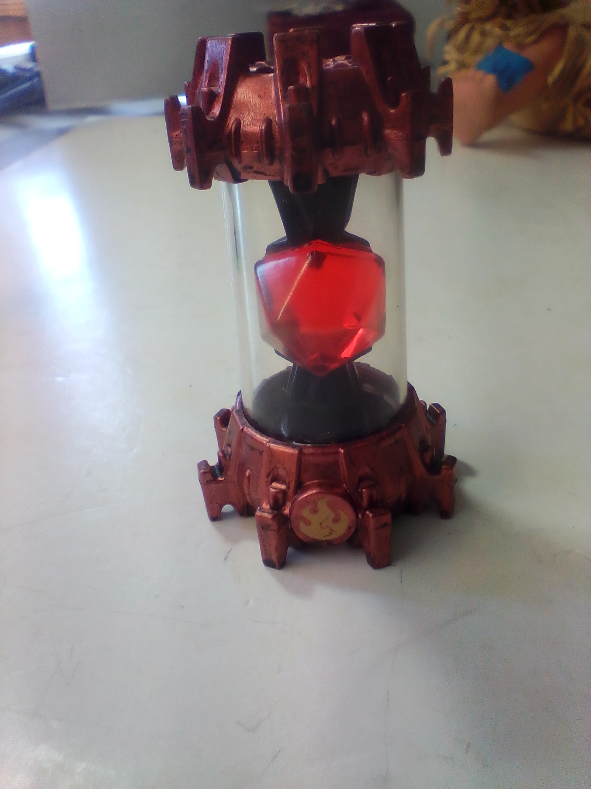 A Collection of Skylanders Interactive Game Pieces and Fire Creation Crystal