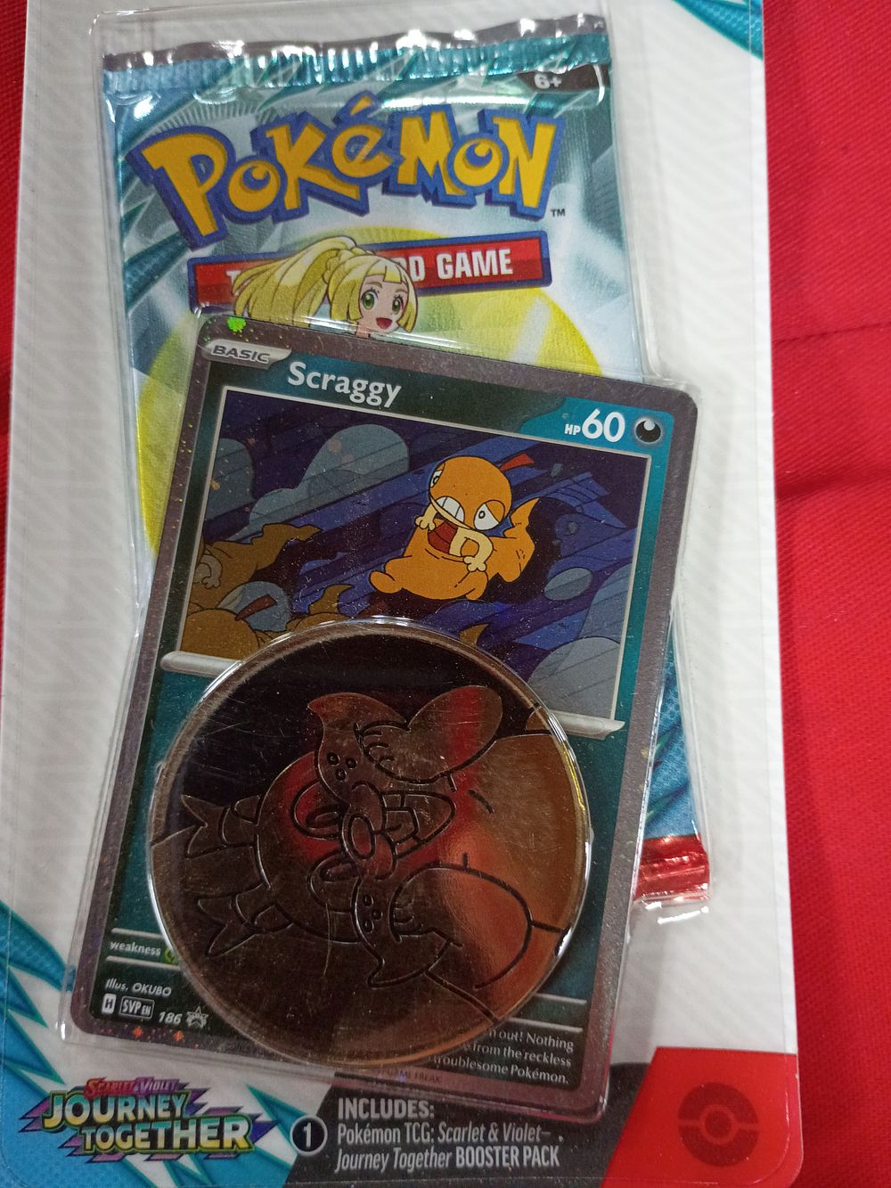 Lot 125: Pokémon TCG Scarlet and Violet Journey Together Scraggy Checklane Blister Pack