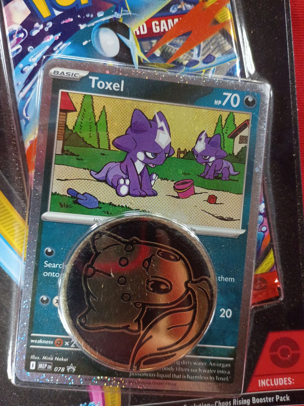 Lot 129: Pokémon TCG Mega Evolution Chaos Rising Blister Pack with Toxel Promo Card and Chikorita Coin