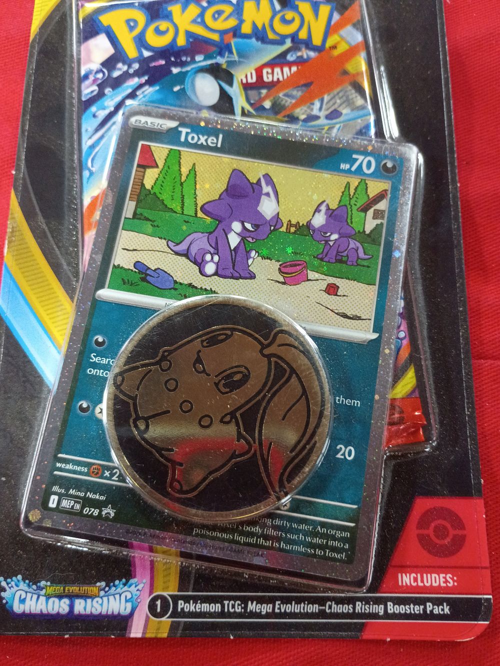 Lot 130: Pokémon TCG Mega Evolution Chaos Rising Single Pack Blister with Toxel Promo and Chikorita Coin