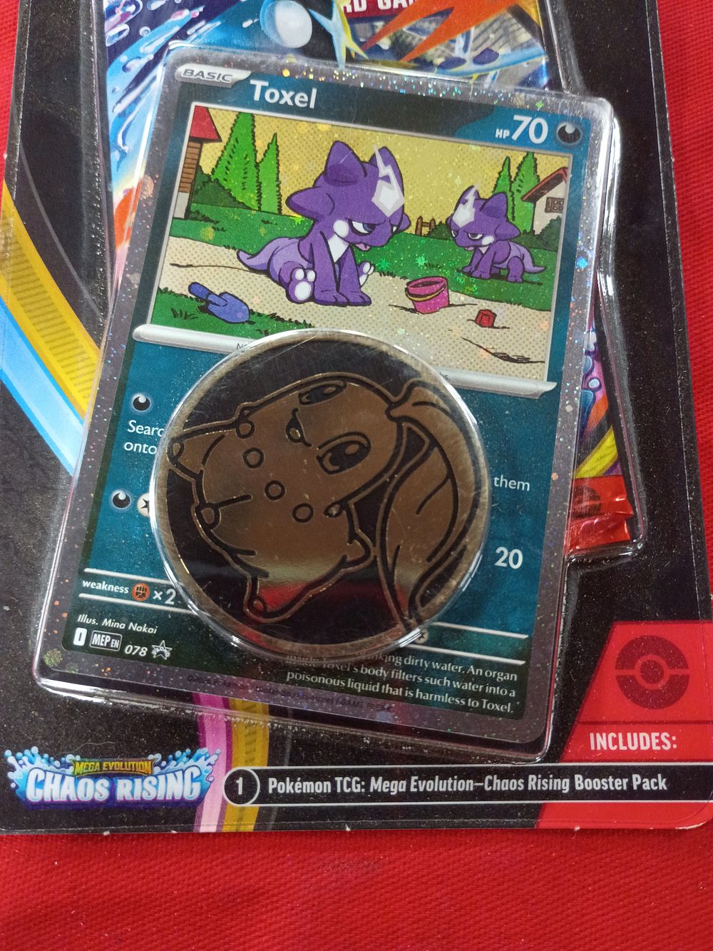 Lot 131: Pokemon TCG Mega Evolution Chaos Rising Single Pack Blister with Toxel Promo Card and Chikorita Coin