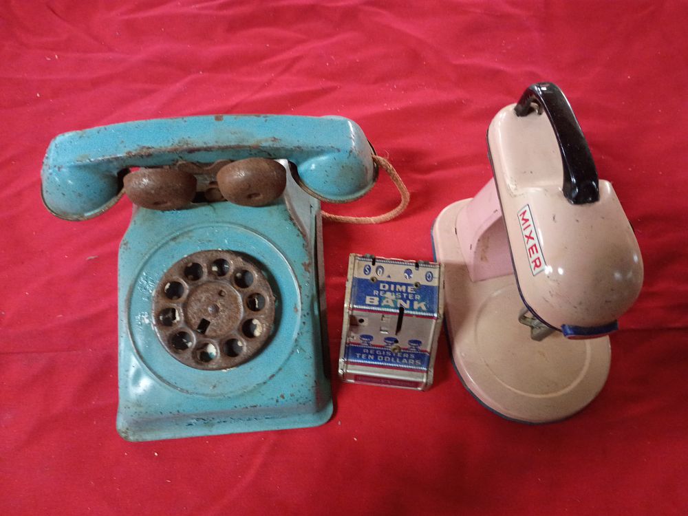 Lot 62: Three Vintage Lithographed Tin Toys Including Rotary Phone, Stand Mixer, and Dime Register Bank
