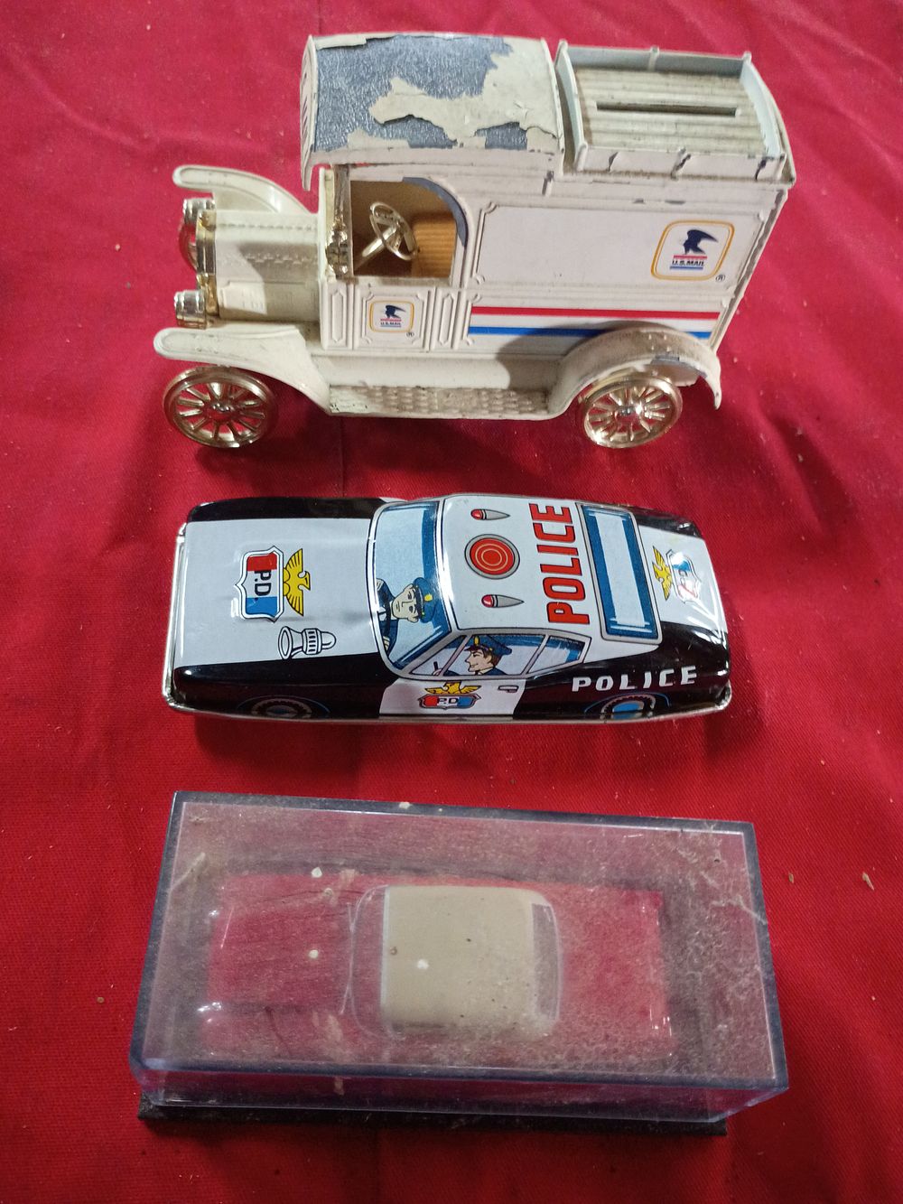 Lot 64: Three Collectible Model Vehicles Including a Ford Model T U.S. Mail Bank and a Tin Lithograph Police Car