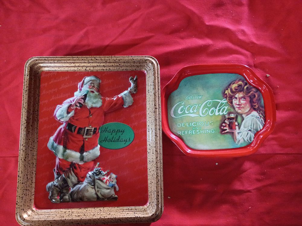 Lot 70: Two Coca-Cola Advertising Collectibles Including Embossed Holiday Tin and Scalloped Metal Tray