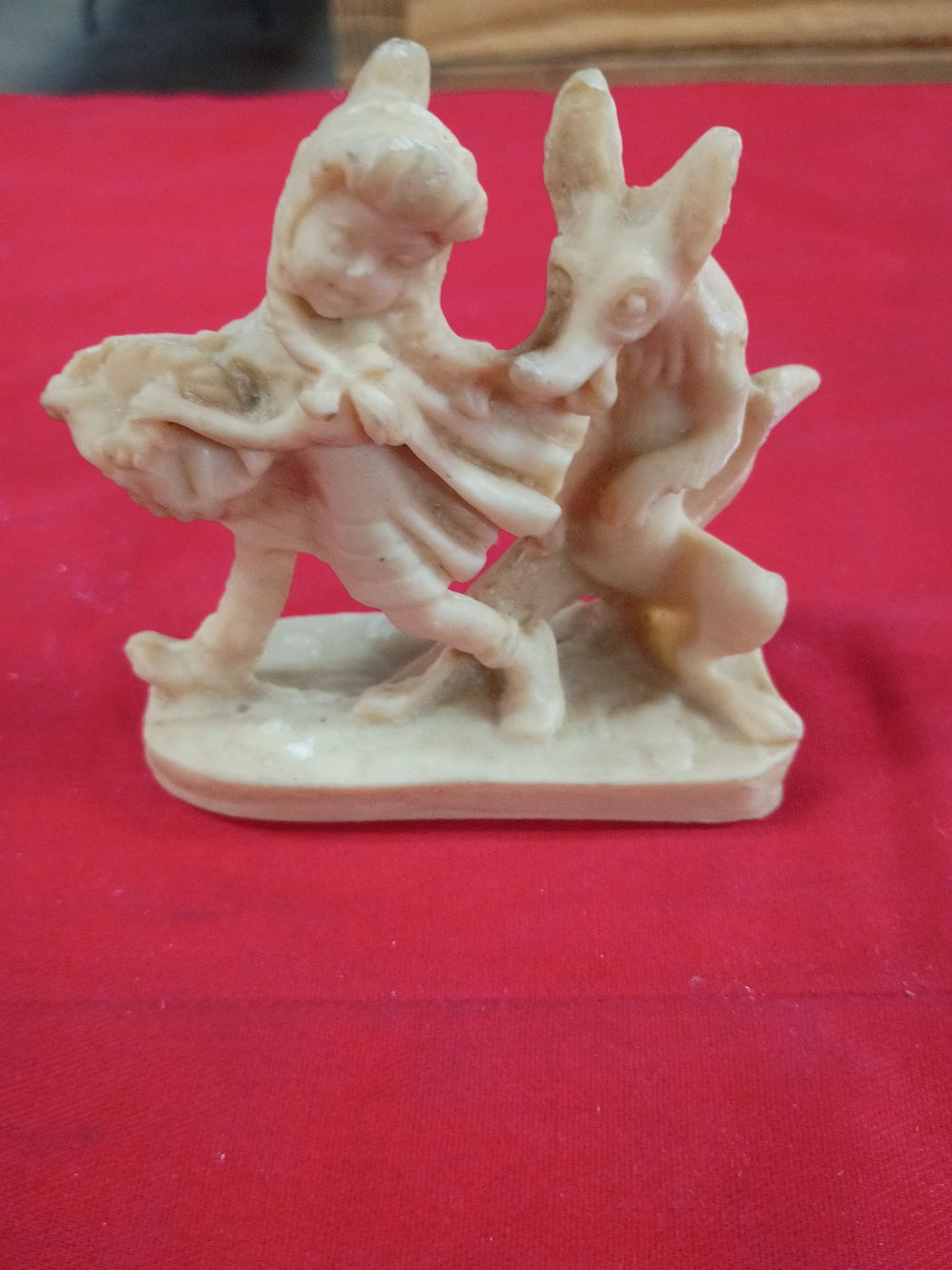 Lot 89: Cast Resin Figurine of a Boy and Donkey