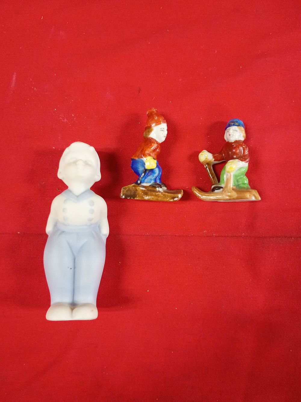 Lot 92: Three Japanese Porcelain Figurines Including Gnomes and a Bisque Character