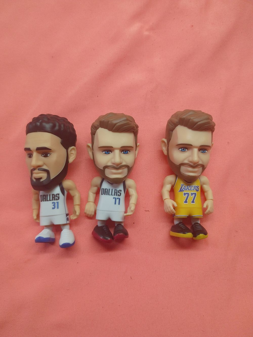 Lot 137: A Trio of Articulated NBA Basketball Player Figurines Including Luka Doncic and Klay Thompson