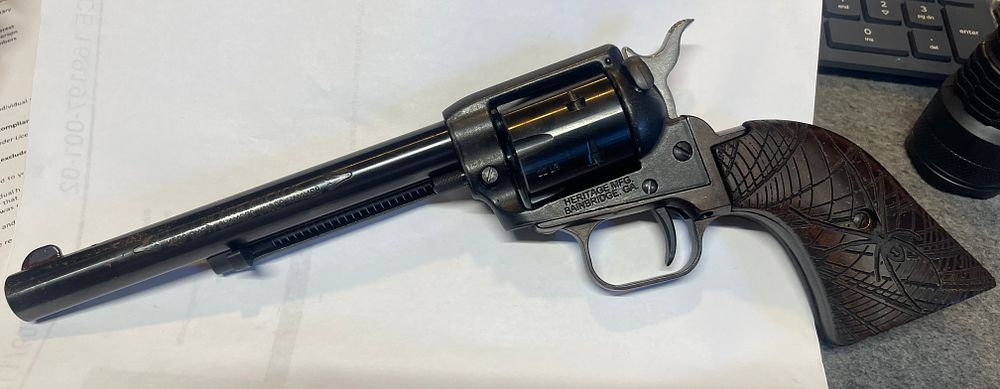 Lot 29: 22LR pistol Heritage single action comes with holster shoots fine