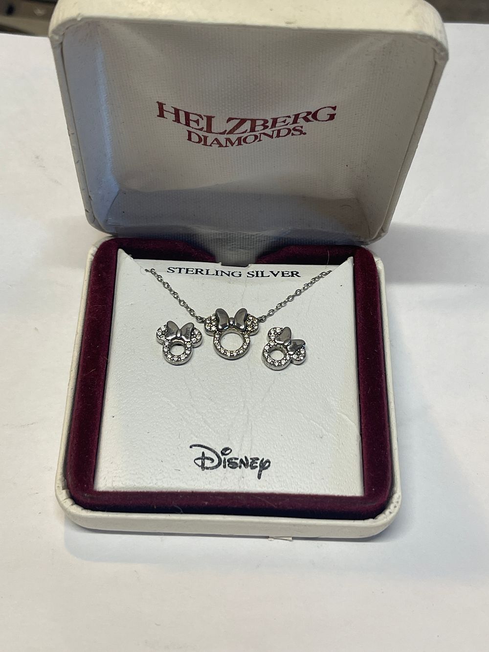 Lot 31: Helzberg diamonds Disney necklace earring set sterling silver I don't know if diamonds are real