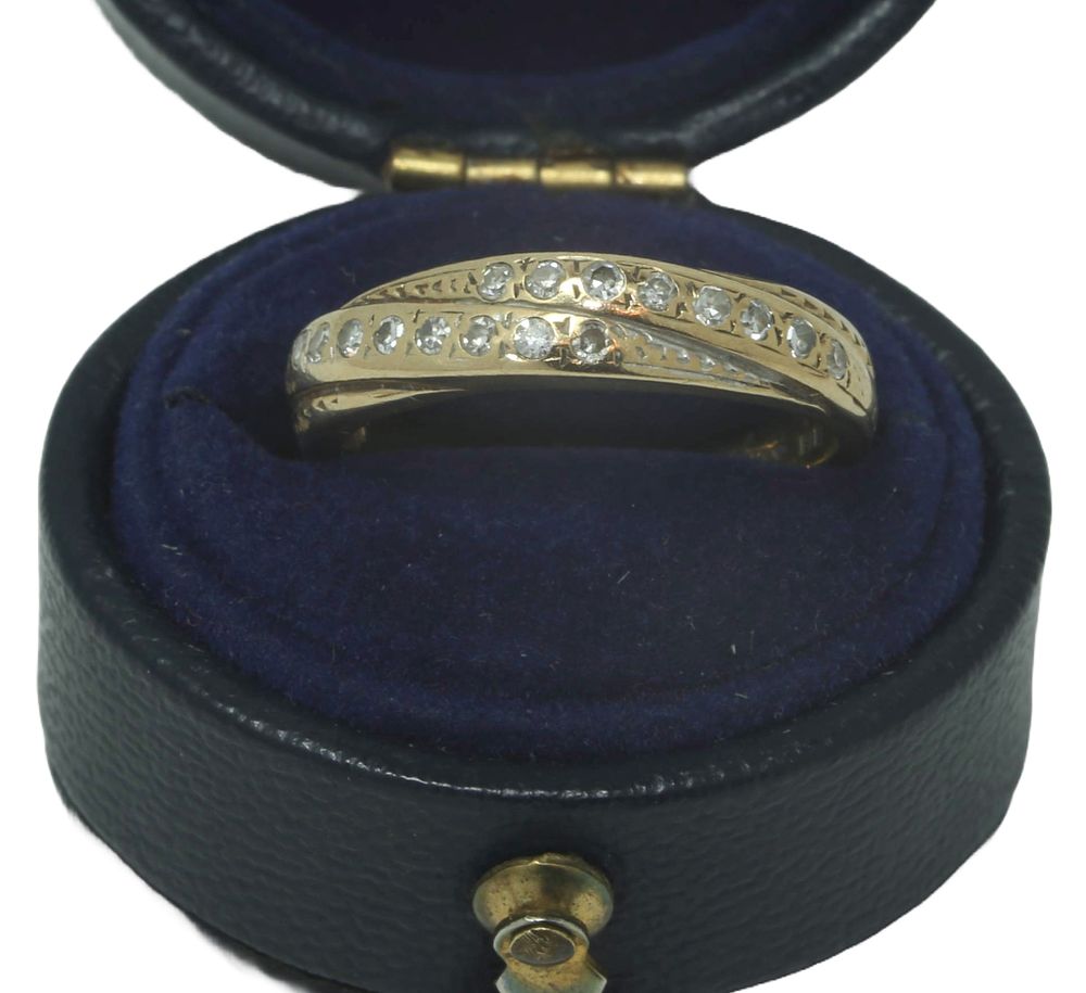 9CT Gold Diamond Twist Band. Size K. Approx 2.28g total weight.