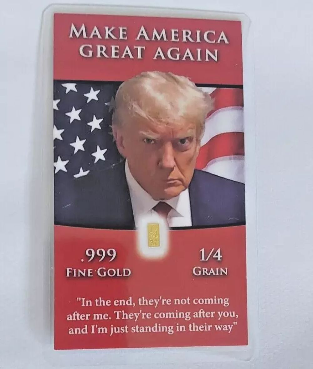 Lot 181: 24ct gold bar trump