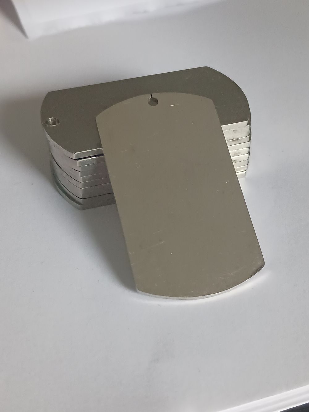 Lot 249: Collection Of Solid Engravable Military ID Dog Tags