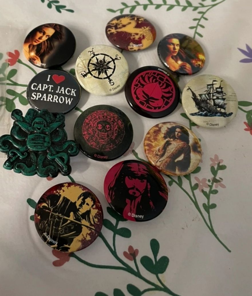 Lot 109: Collection of pirates of Caribbean badge Collection