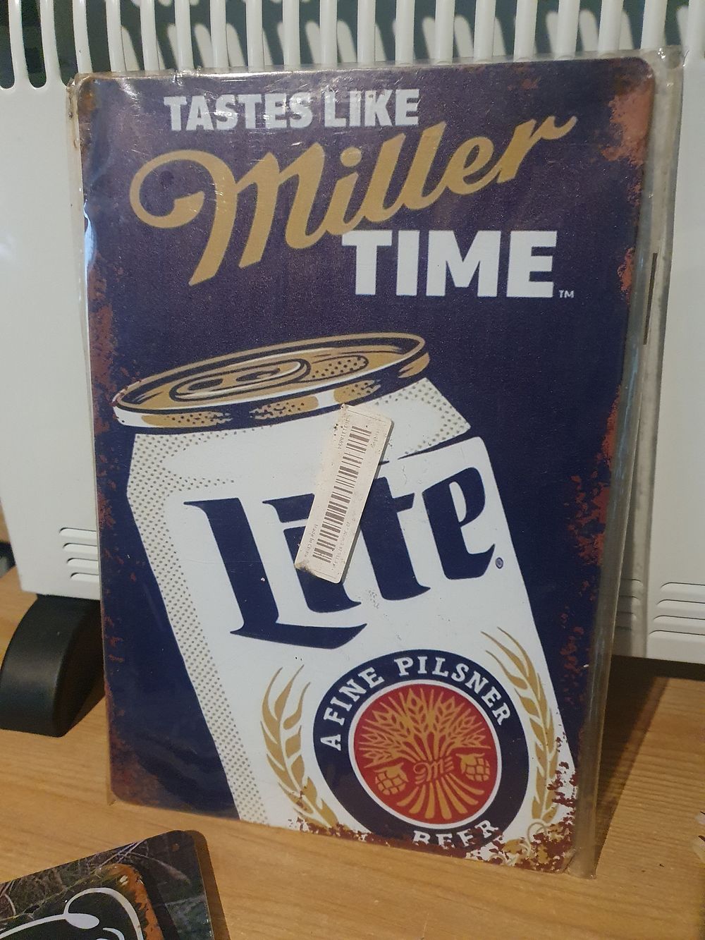 Lot 93: Miller tin sign
