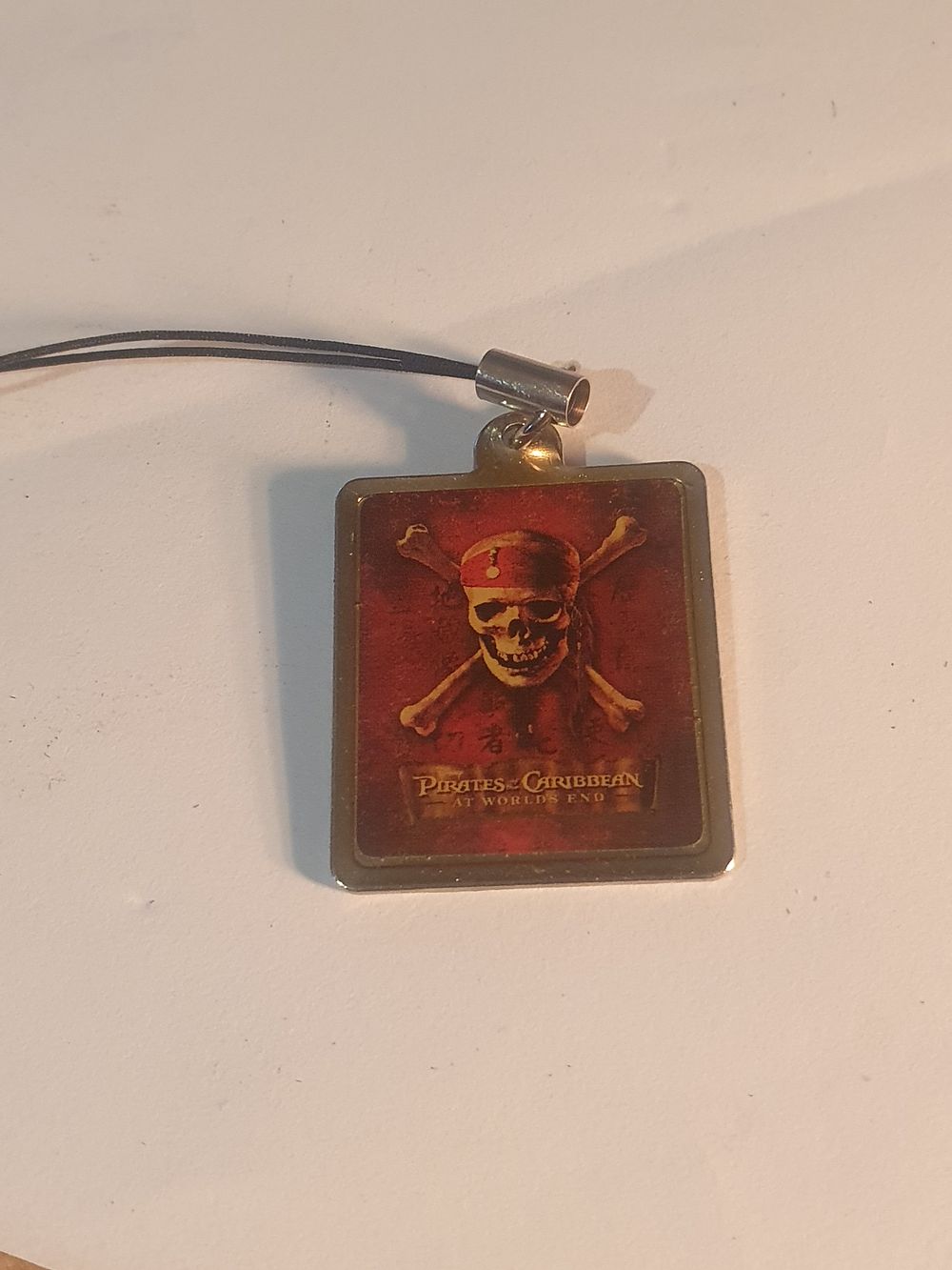 Lot 332: Disney pirate of Caribbean pendant