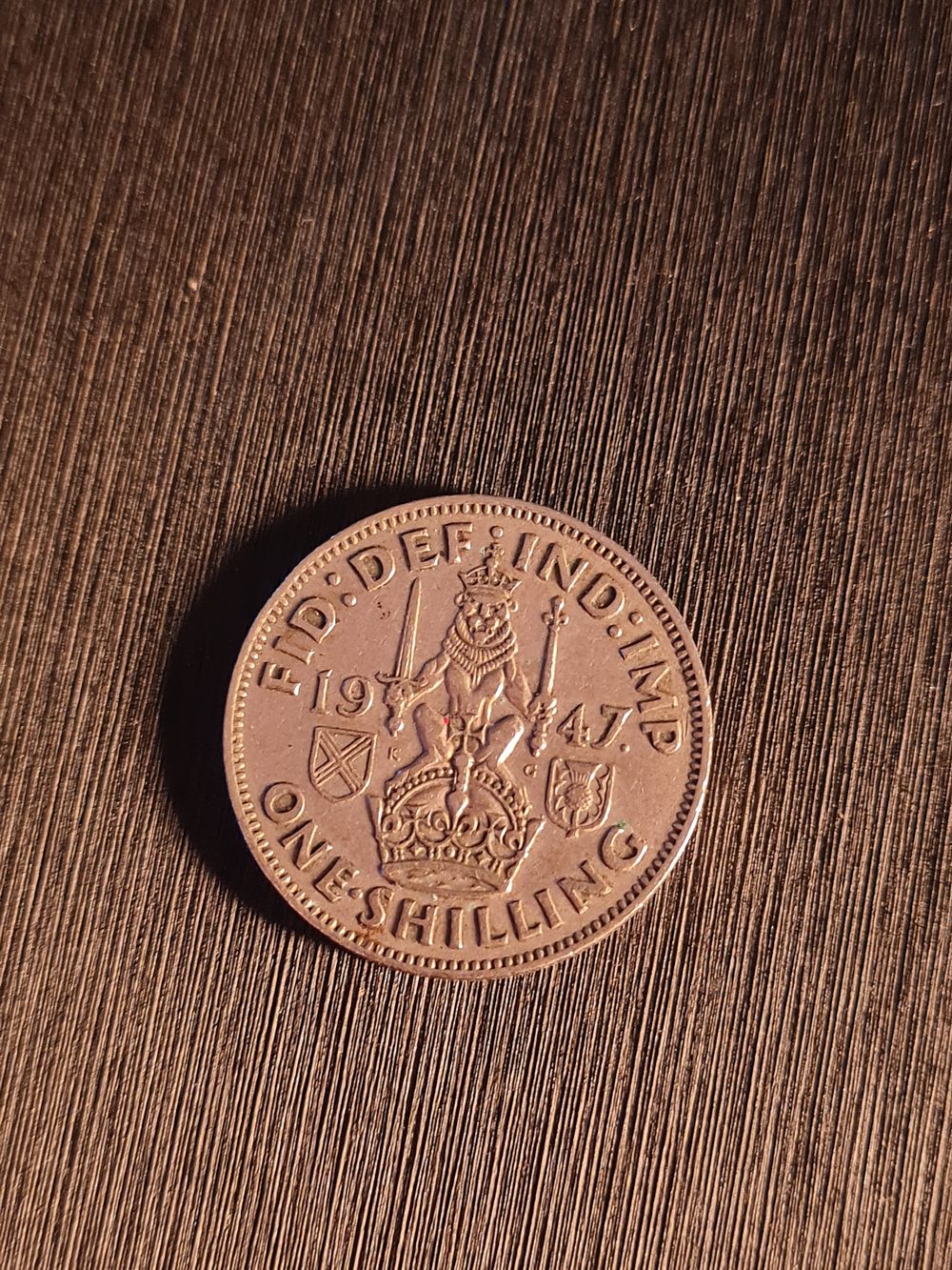 Lot 431: 1947 one shilling