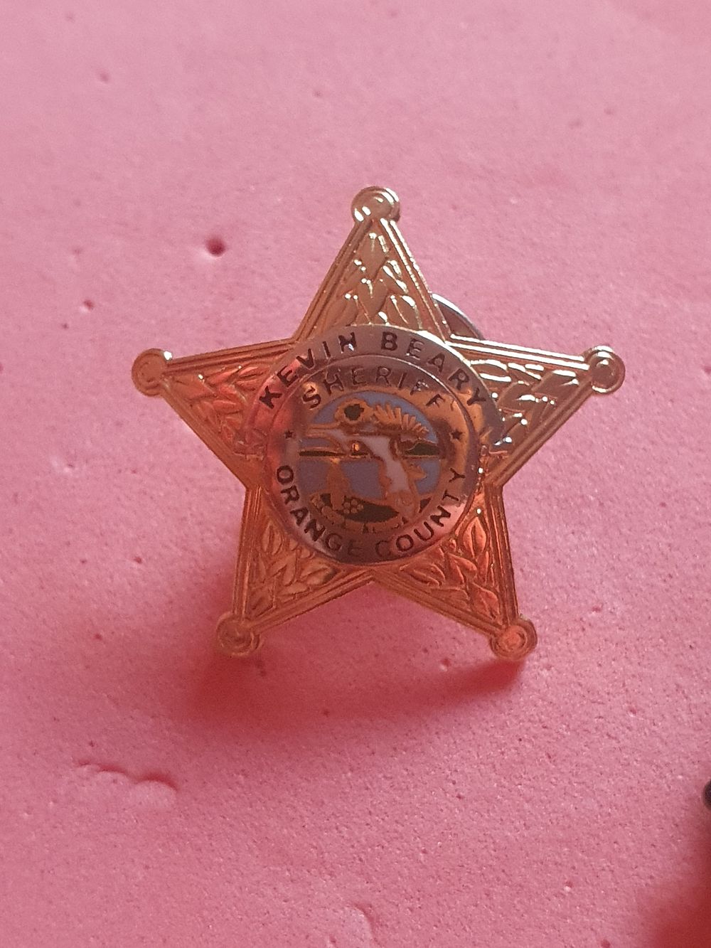 Lot 503: Orange country badge
