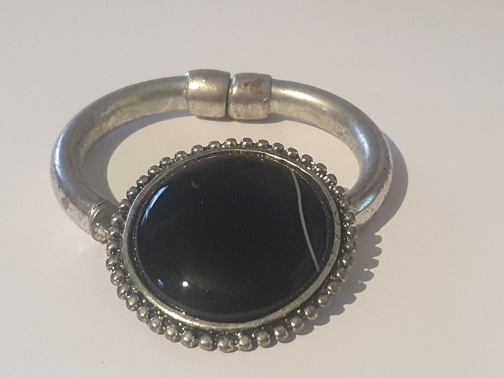 Lot 198: Large magnetic black stone bangle