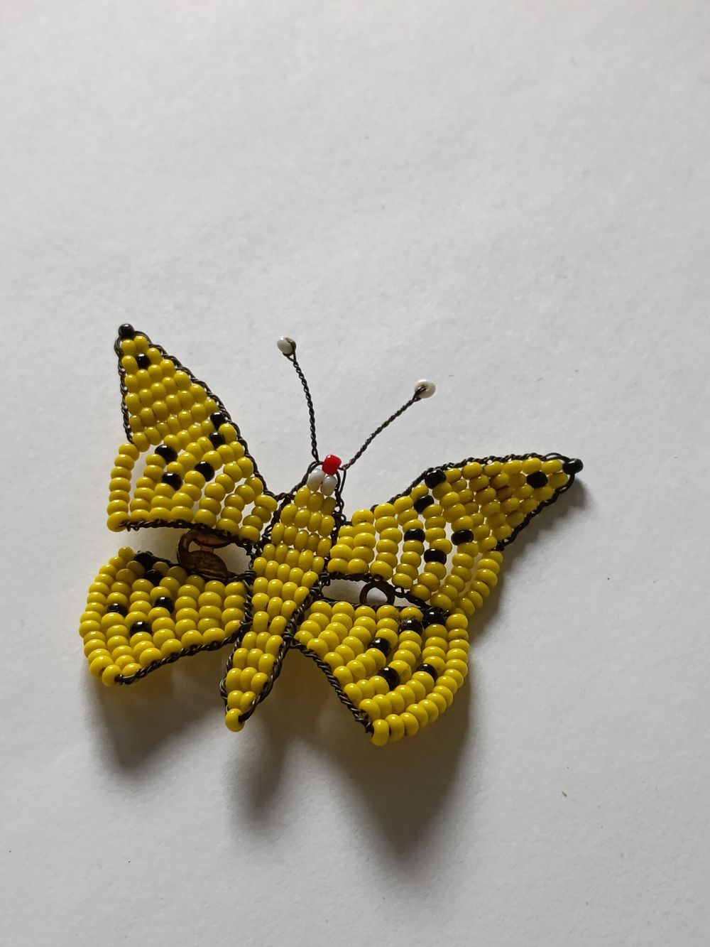Lot 207: Yellow beaded butterfly broach