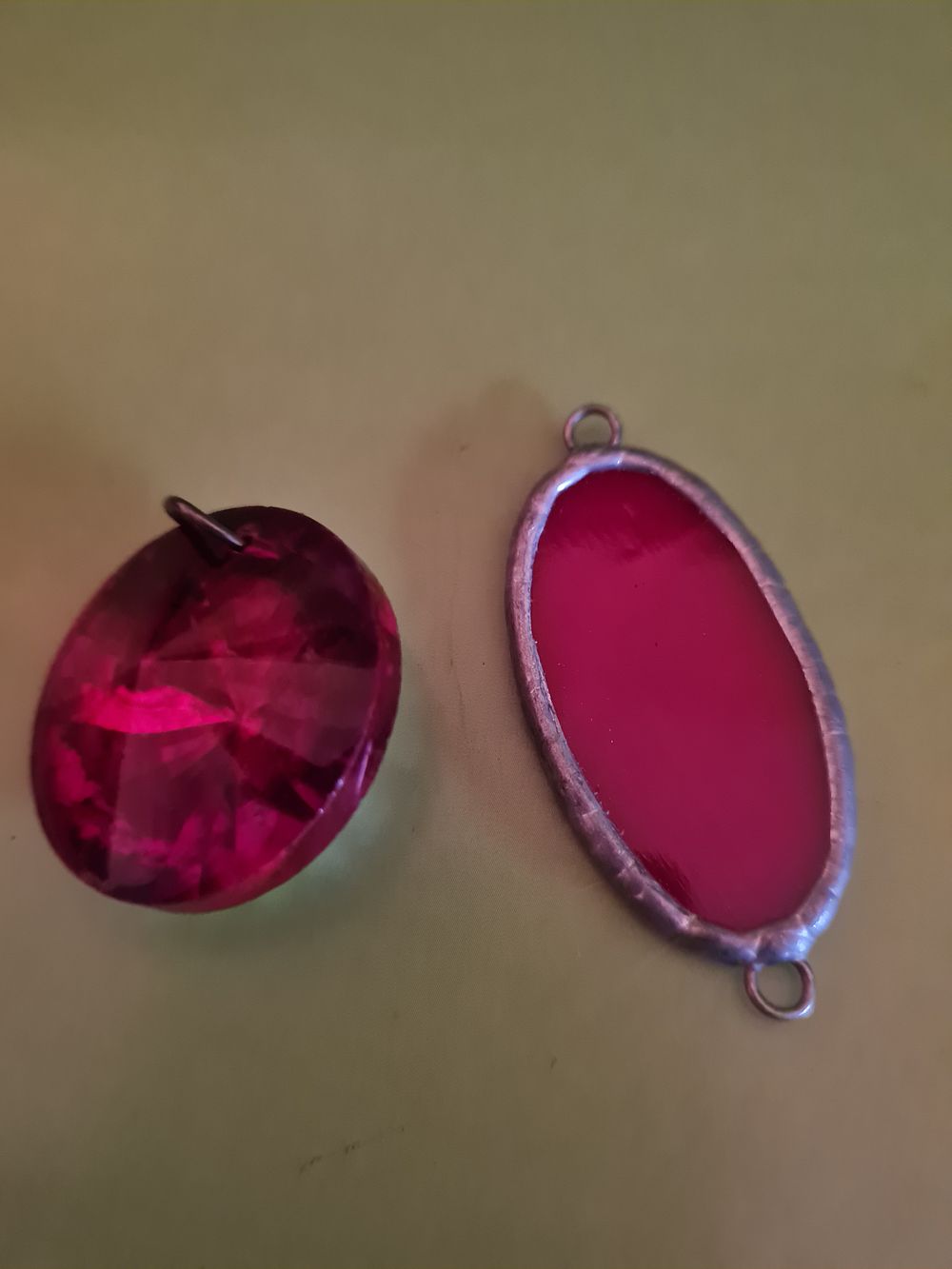 Lot 191s: 2 red srone pendants
