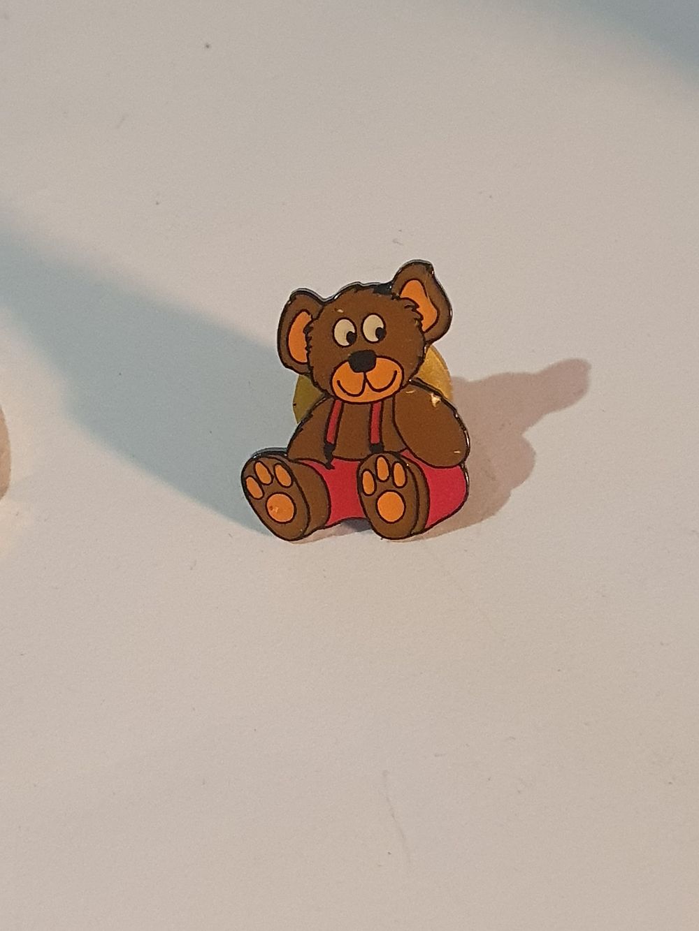 Lot 498: Teddy bear pin badge