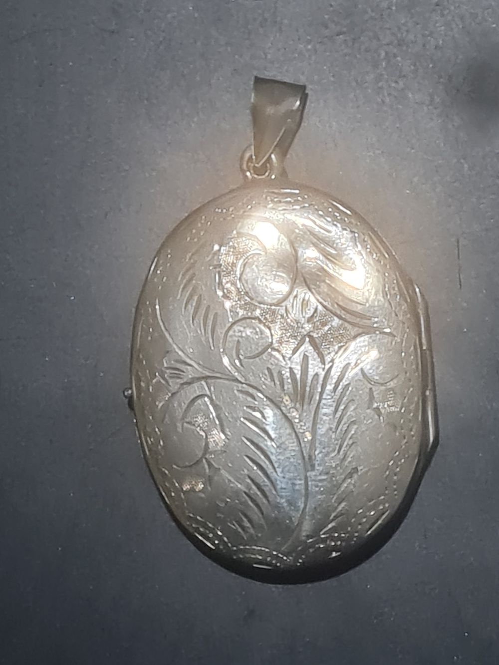 Lot 327: Large silver stamped locket
