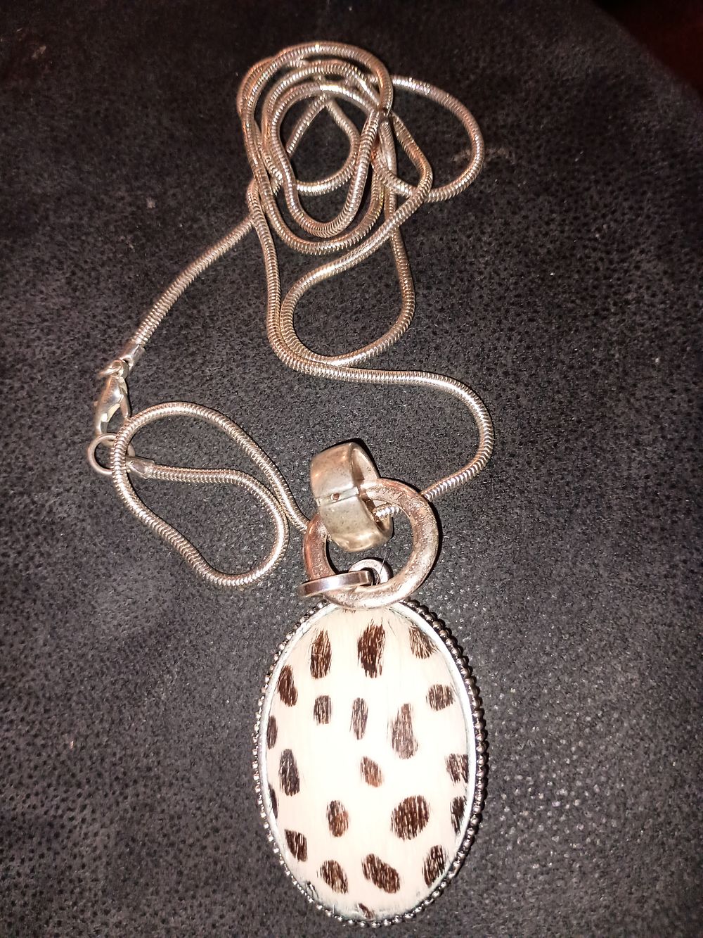 Lot 85: Very long snake chain with pendant