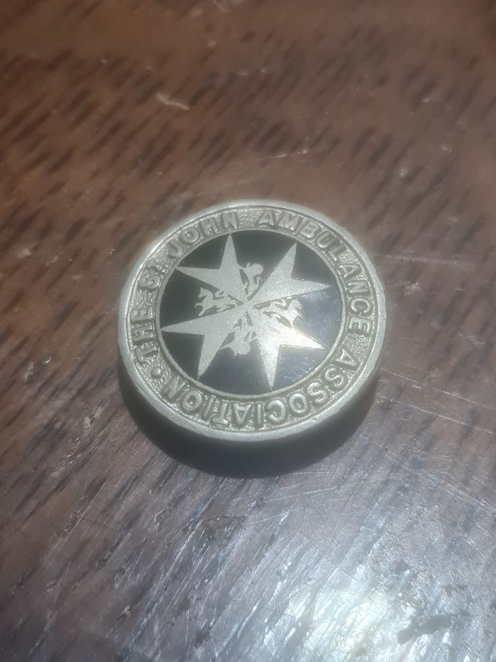Lot 115: Vintage stamped st john badge