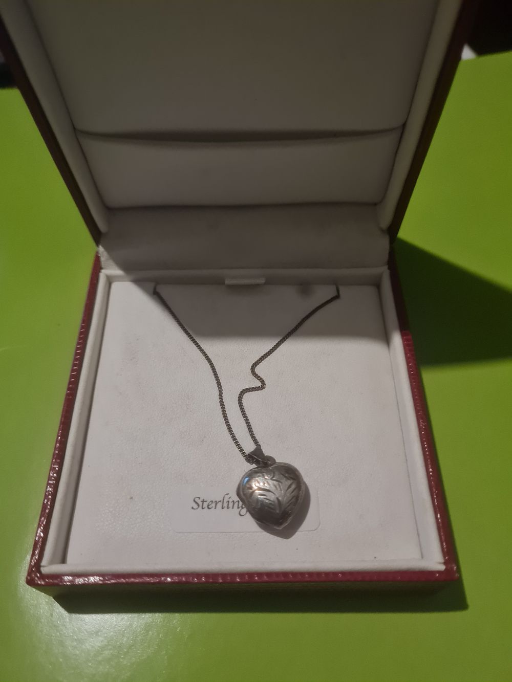 Lot 319: Sterling silver chain & locket boxed