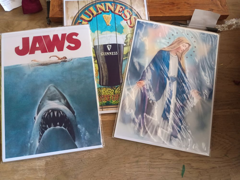 Lot 205: Collection of high gloss print in protective cardboard sleeve