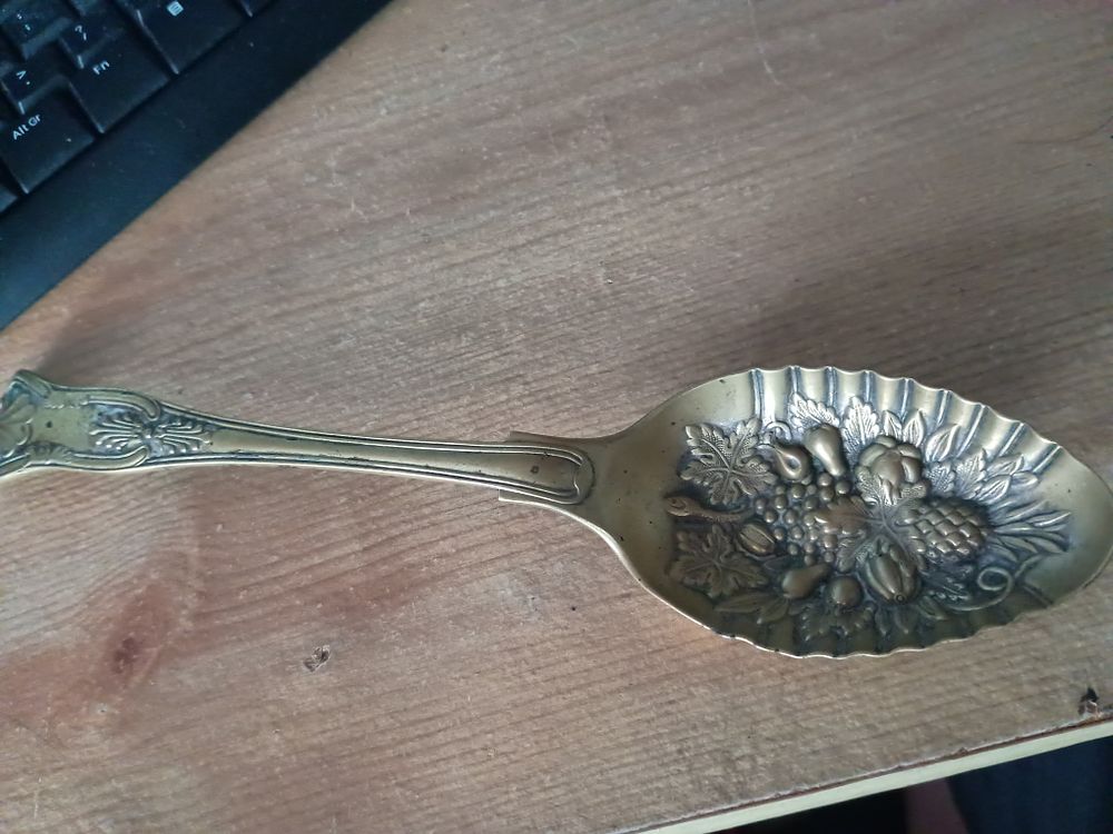 Lot 97: Large brass spoon