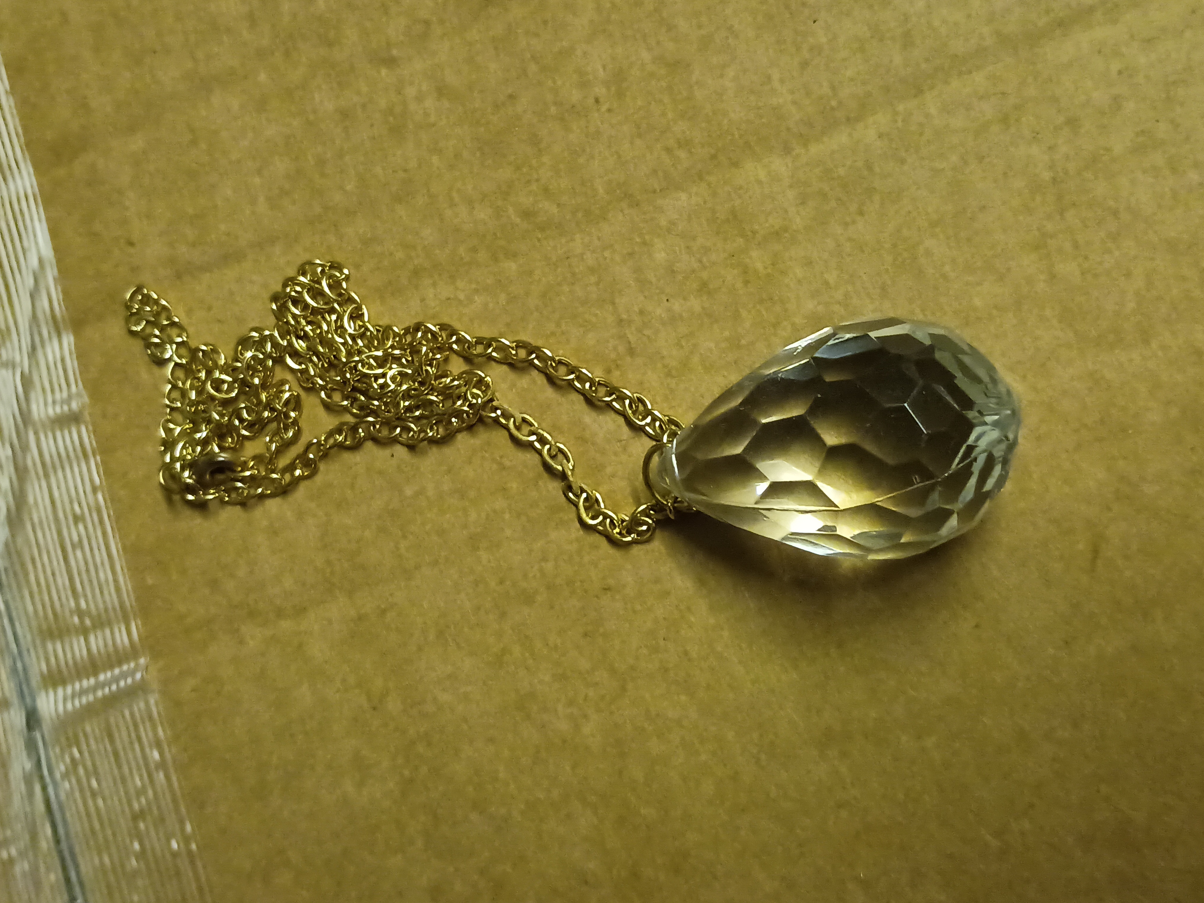 Gold tone chain with large crystal style pendant