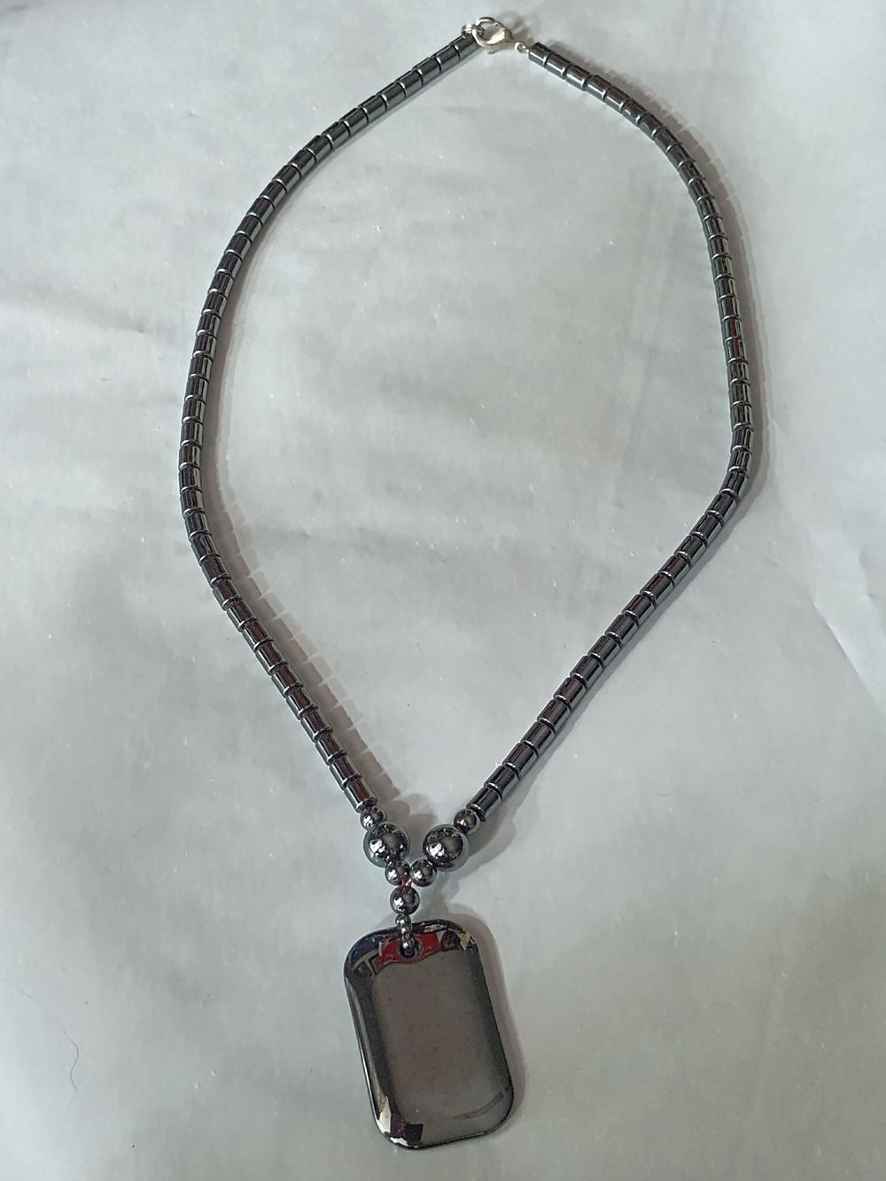 Lot 234: Beautiful Solid Pendant with Chain
