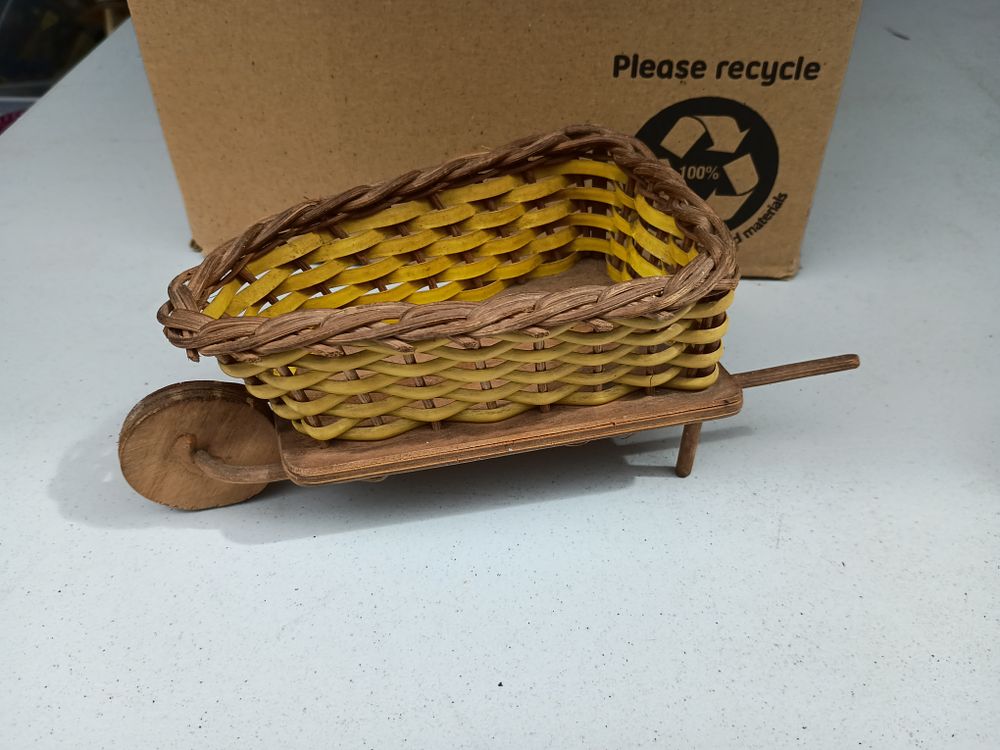 Lot 142: Wooden with wicker basket wheelbarrow