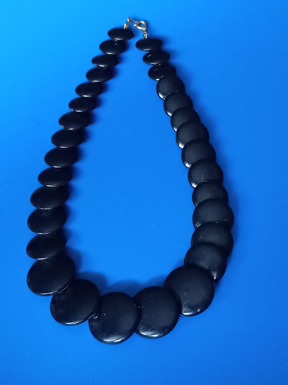 Lot 42: Black disc pendant necklace