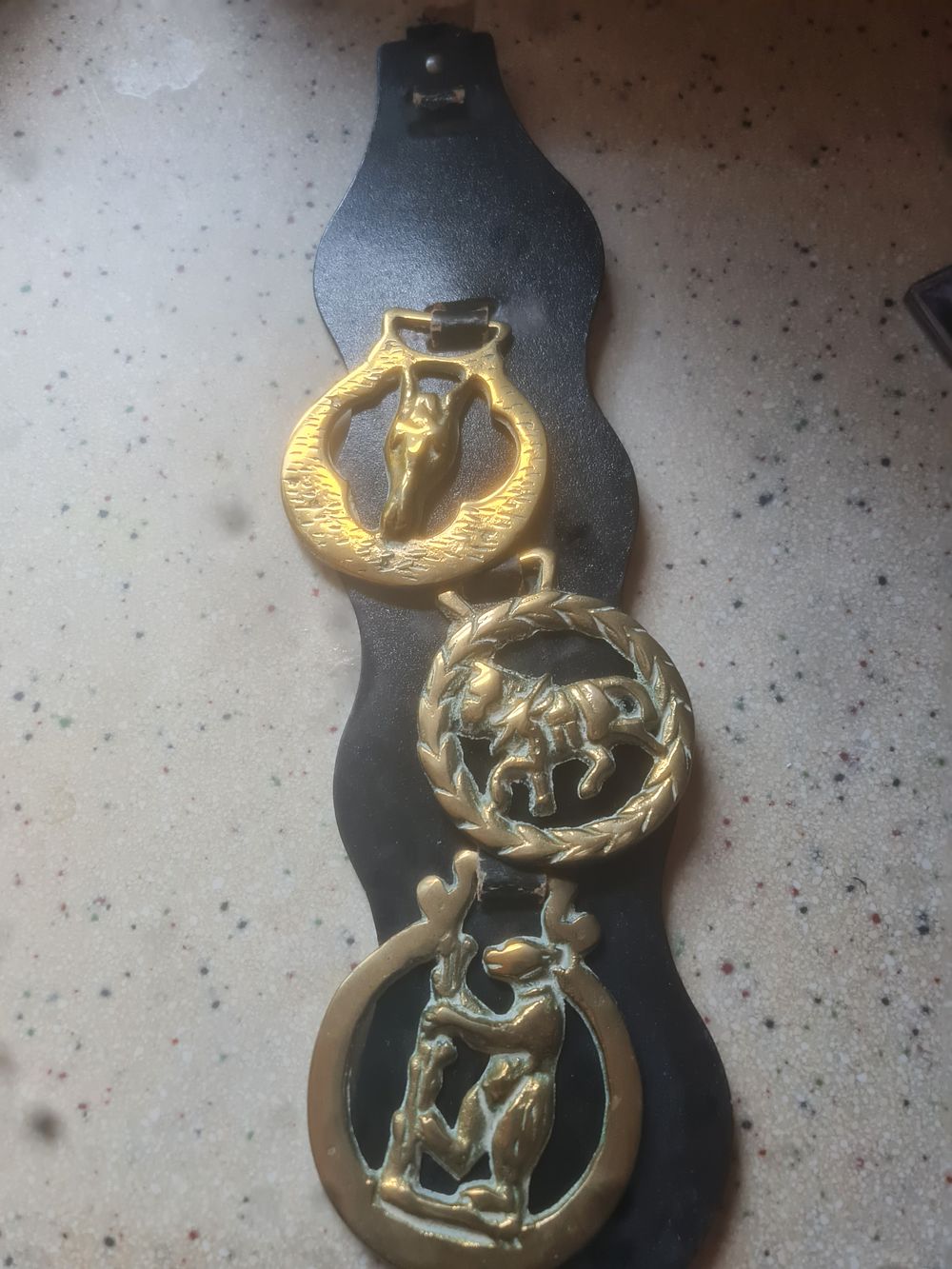 Lot 135: Brass horse shoe belt